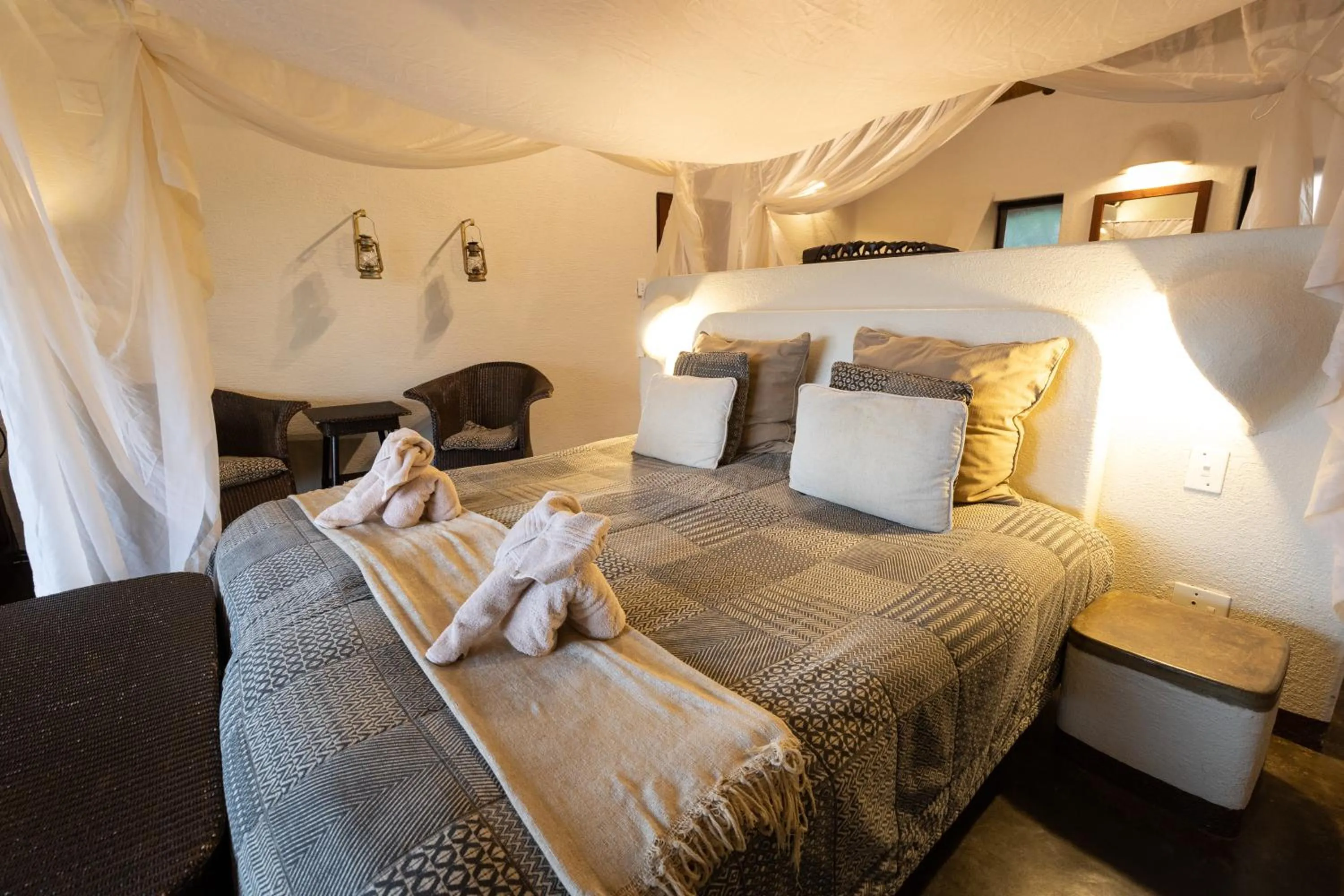 Bed in Nyati Safari Lodge