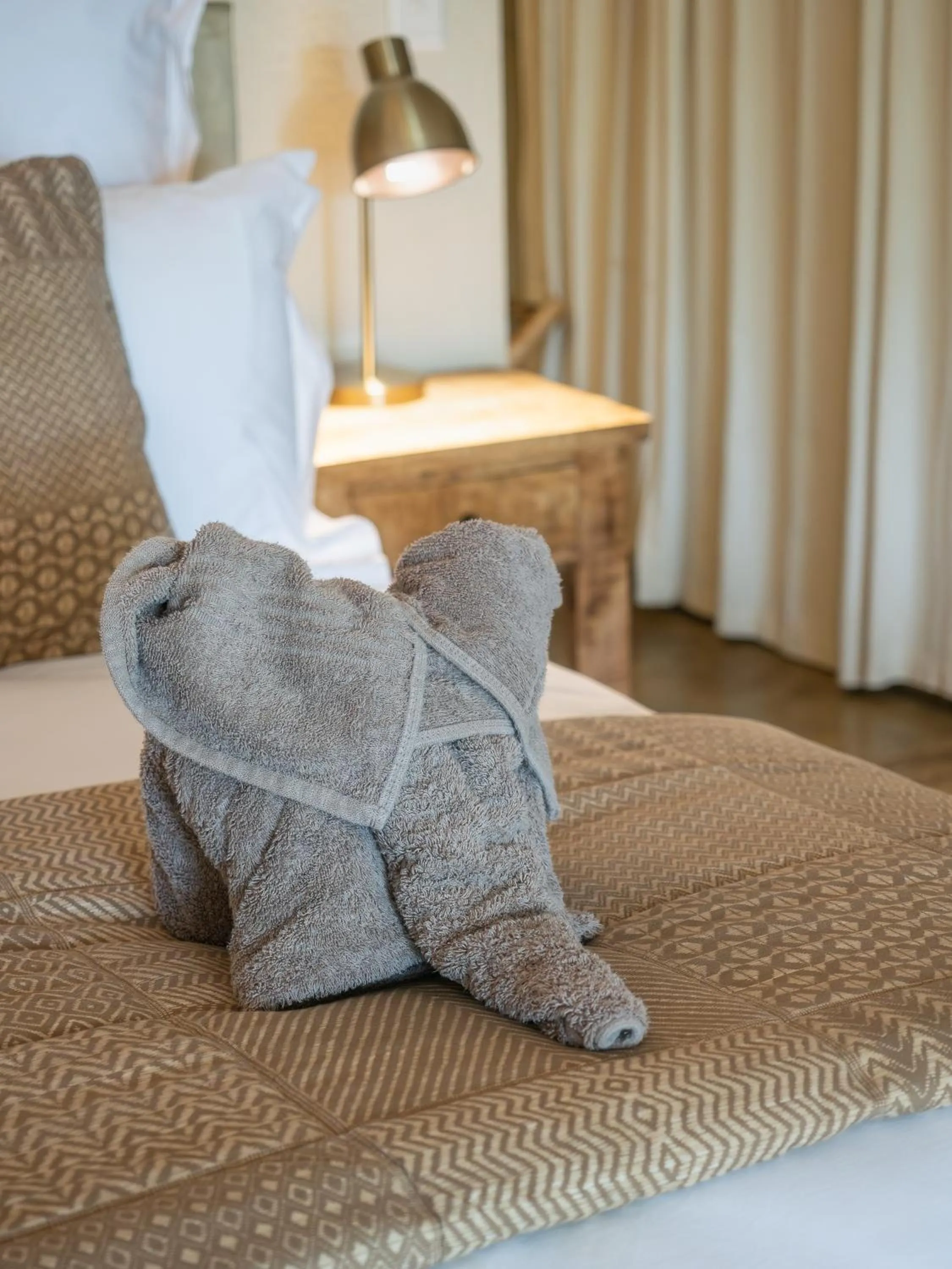 Bed in Nyati Safari Lodge