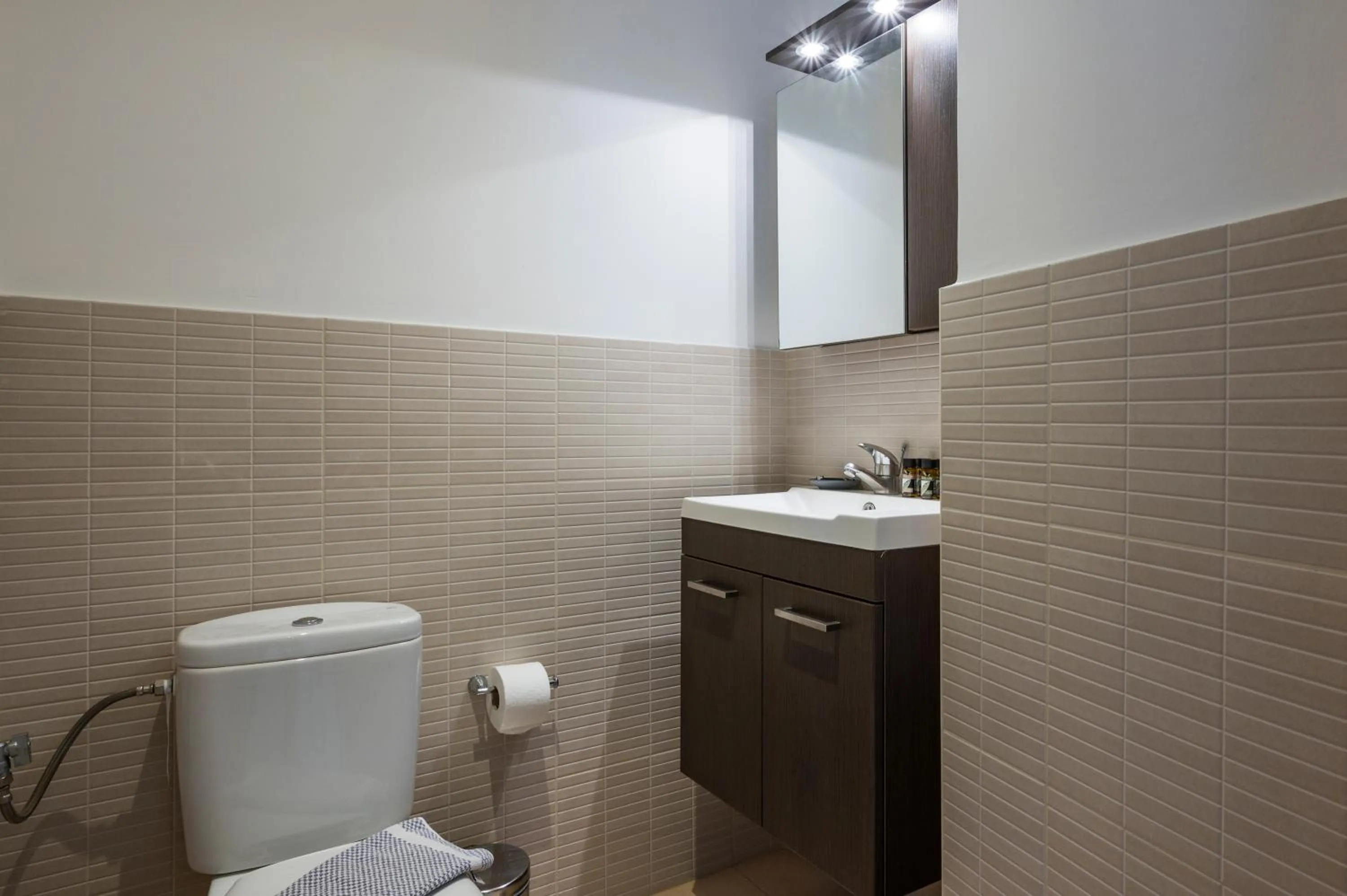 Toilet in Trianon Luxury Apartments & Suites