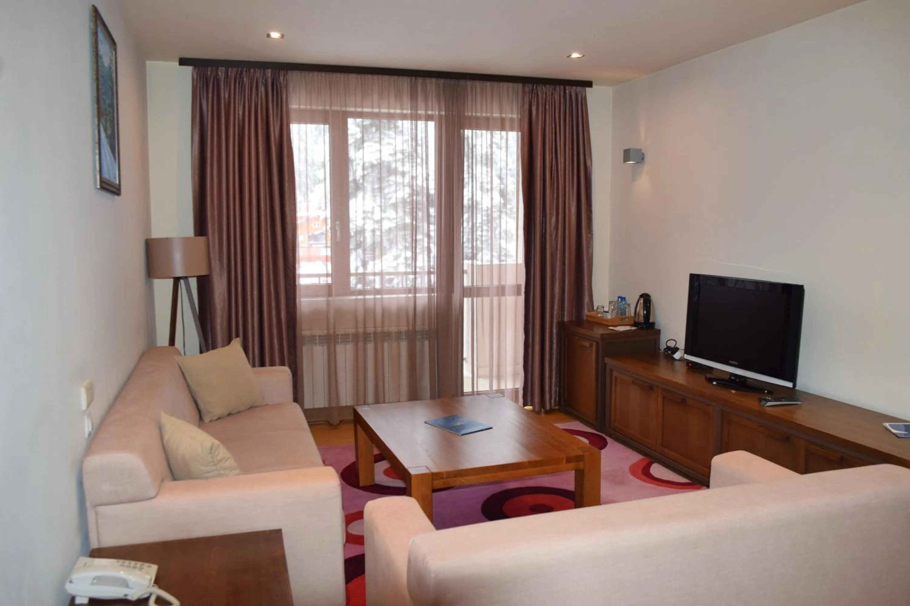 Communal lounge/ TV room in The Lodge Hotel