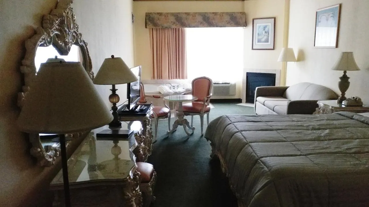 Bed in Palace Inn & Suites