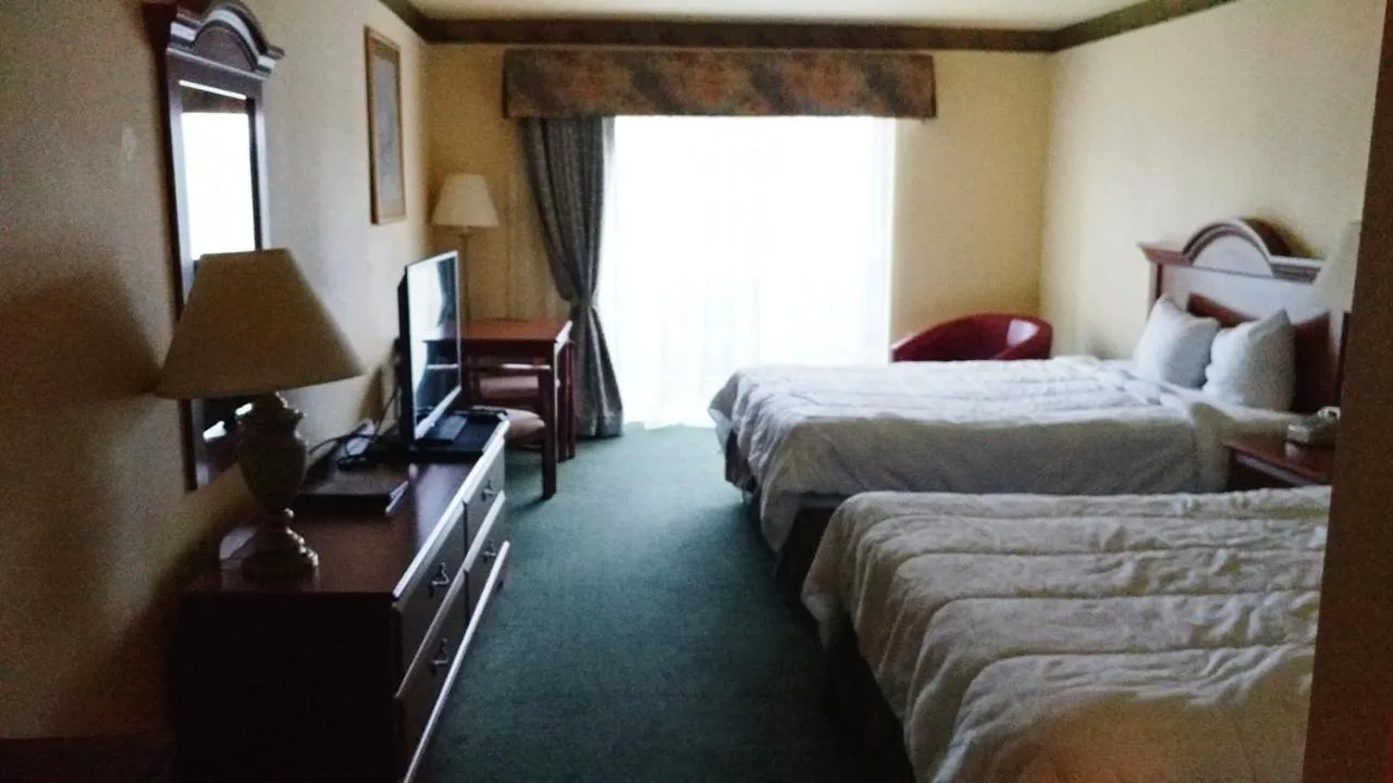 Bed in Palace Inn & Suites