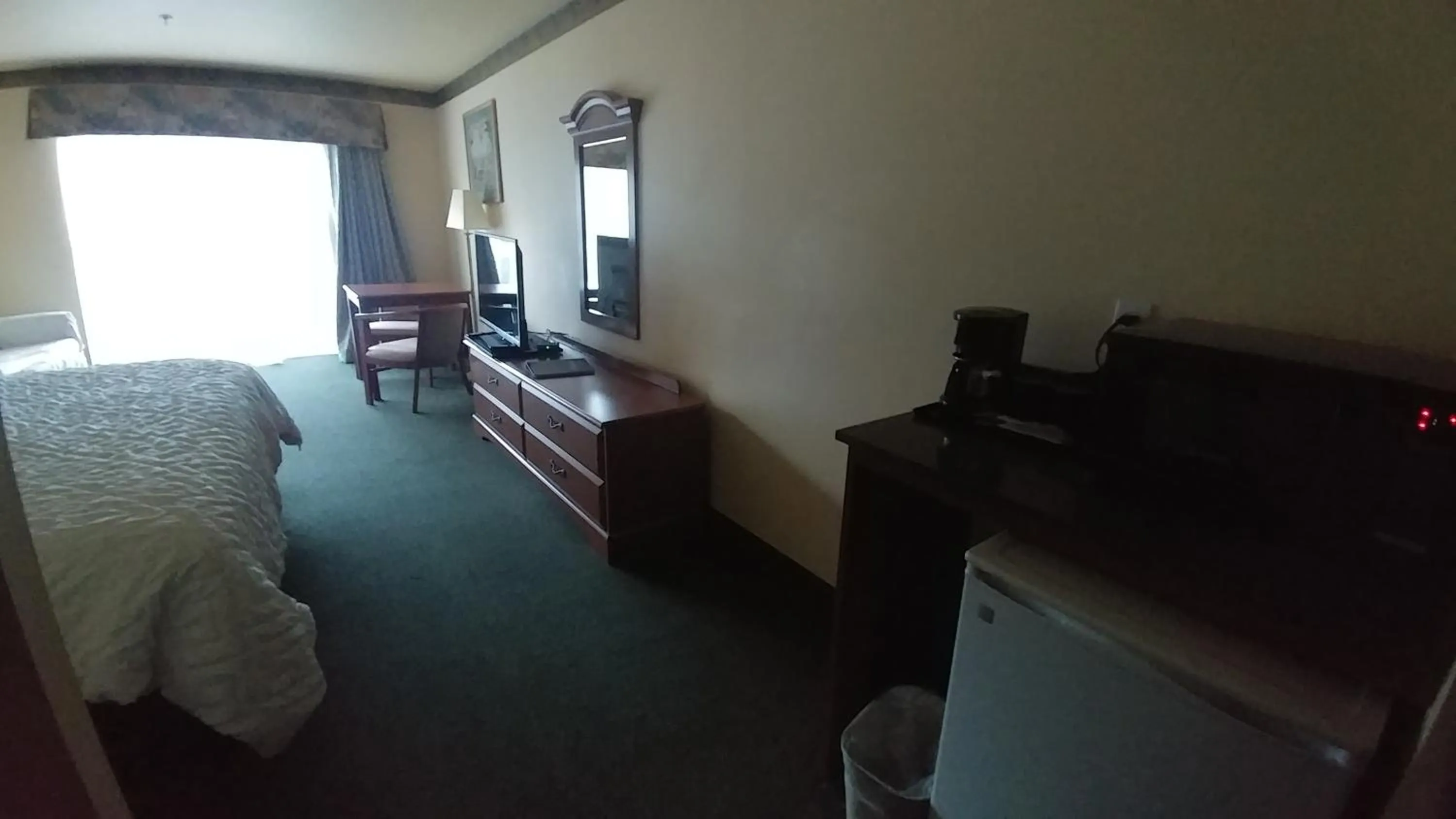 Bed in Palace Inn & Suites