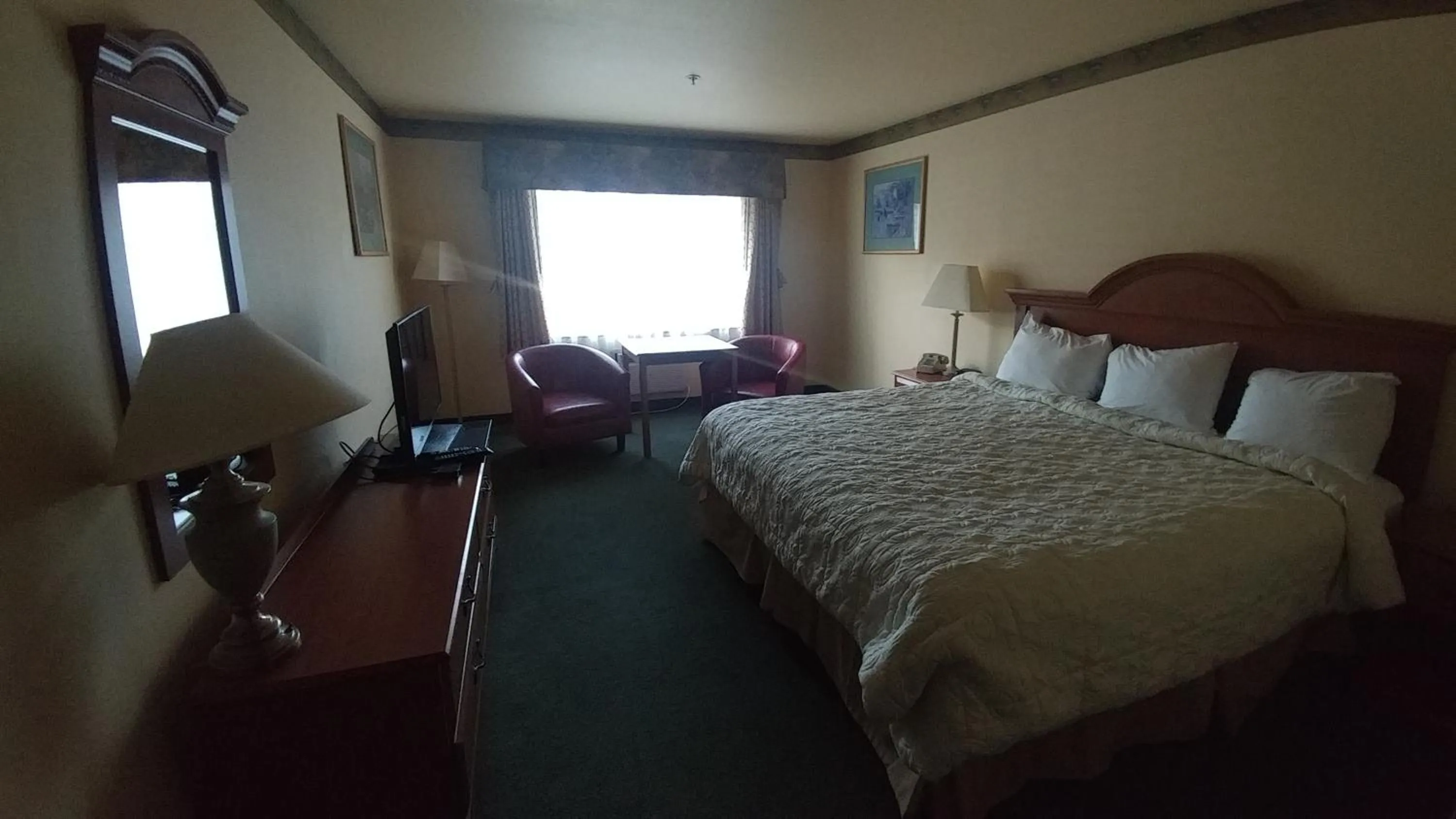 Bed in Palace Inn & Suites
