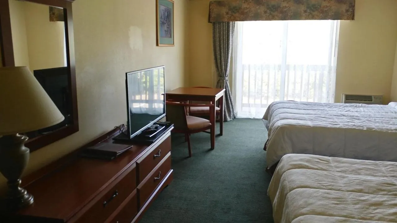 Bed in Palace Inn & Suites
