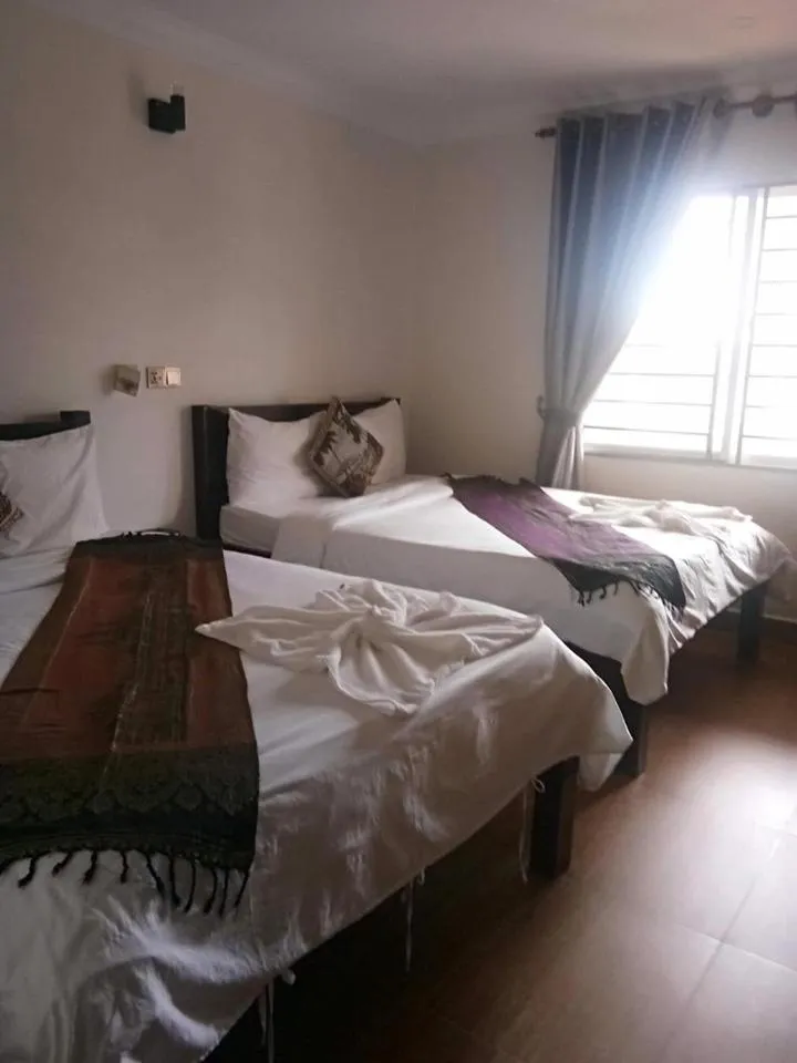Bed in TWIN HOME Guesthouse