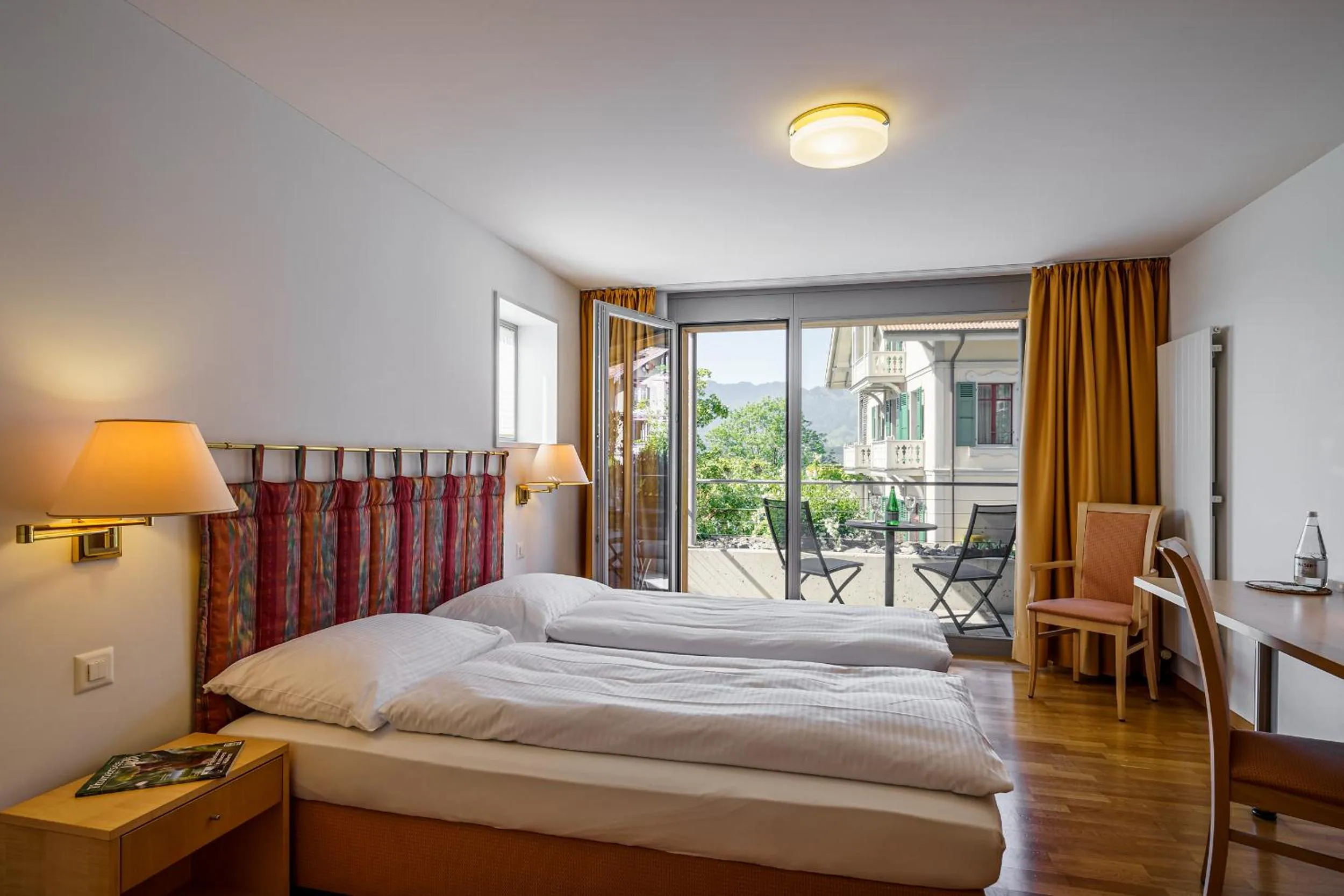 Photo of the whole room, Bed in Schönbühl Hotel & Restaurant Lake Thun