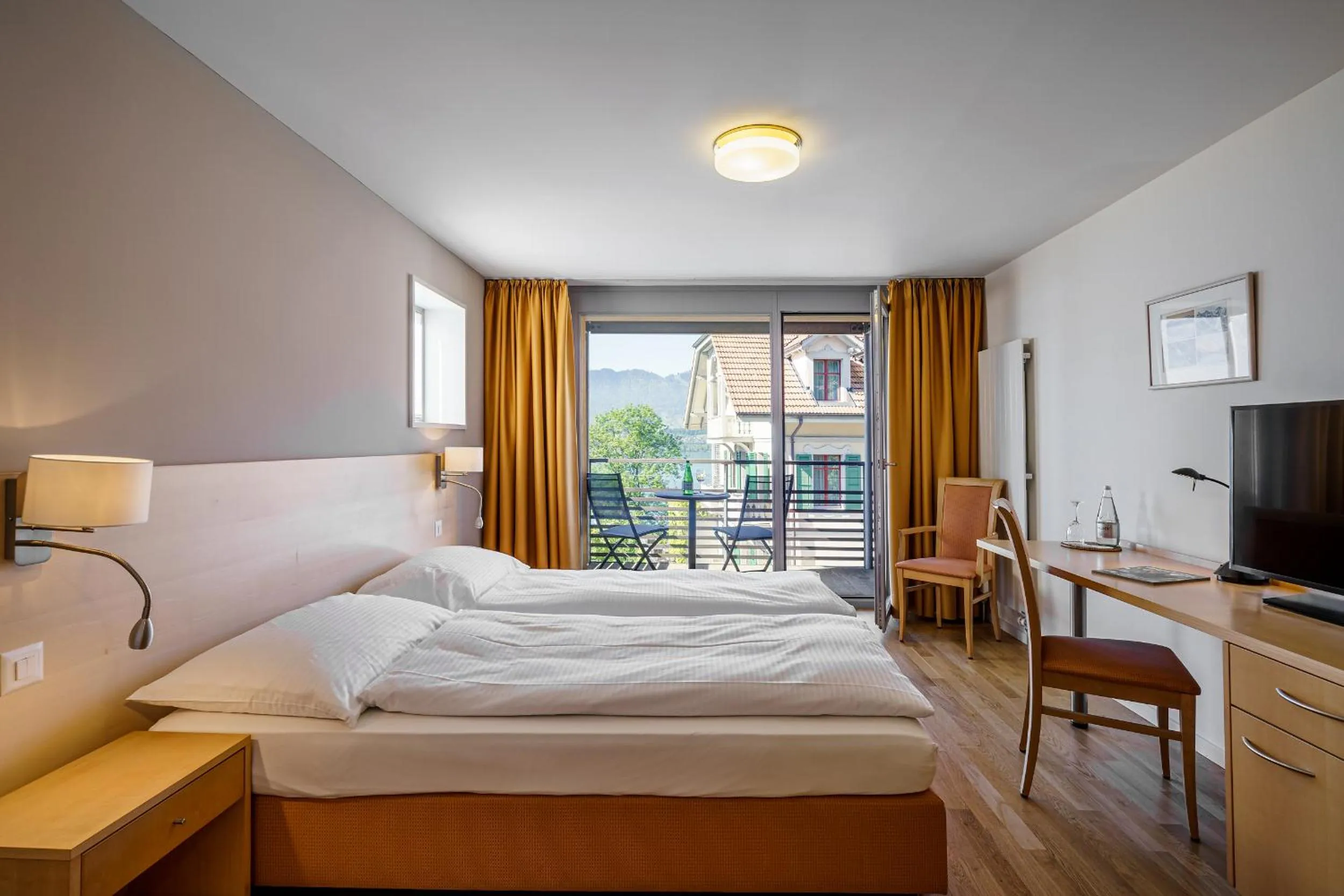 Photo of the whole room, Bed in Schönbühl Hotel & Restaurant Lake Thun