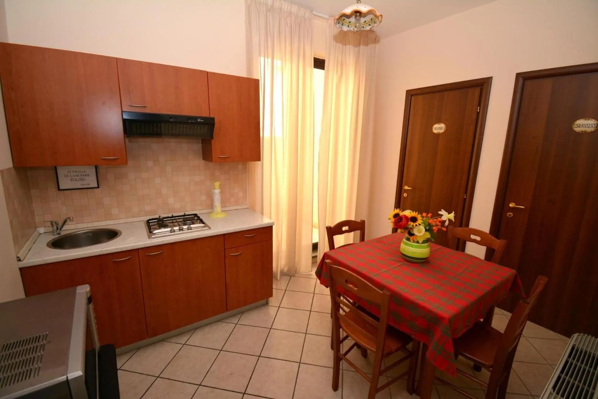 Communal kitchen in Affittacamere La Piazzetta