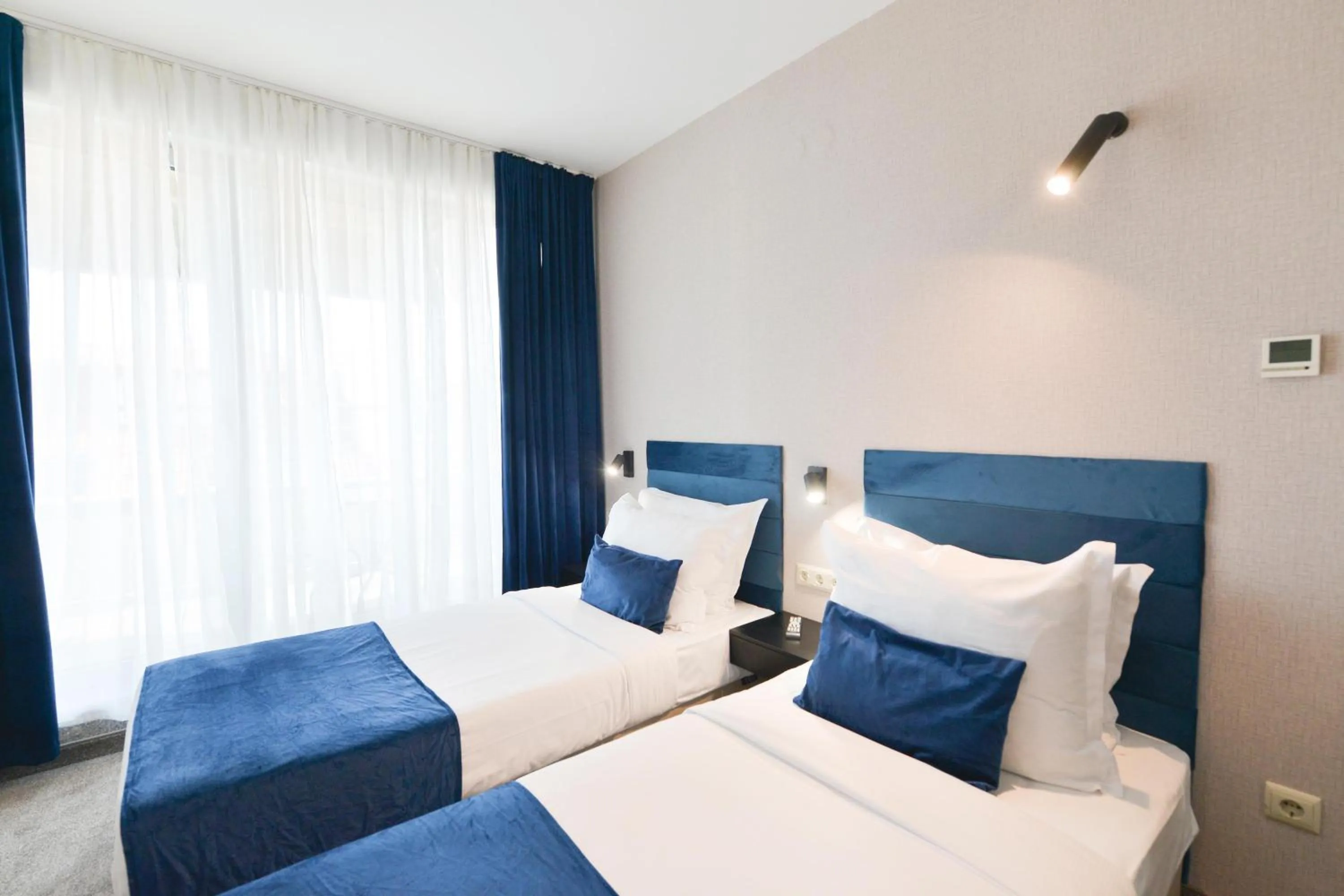 Bed in Art Plaza Hotel