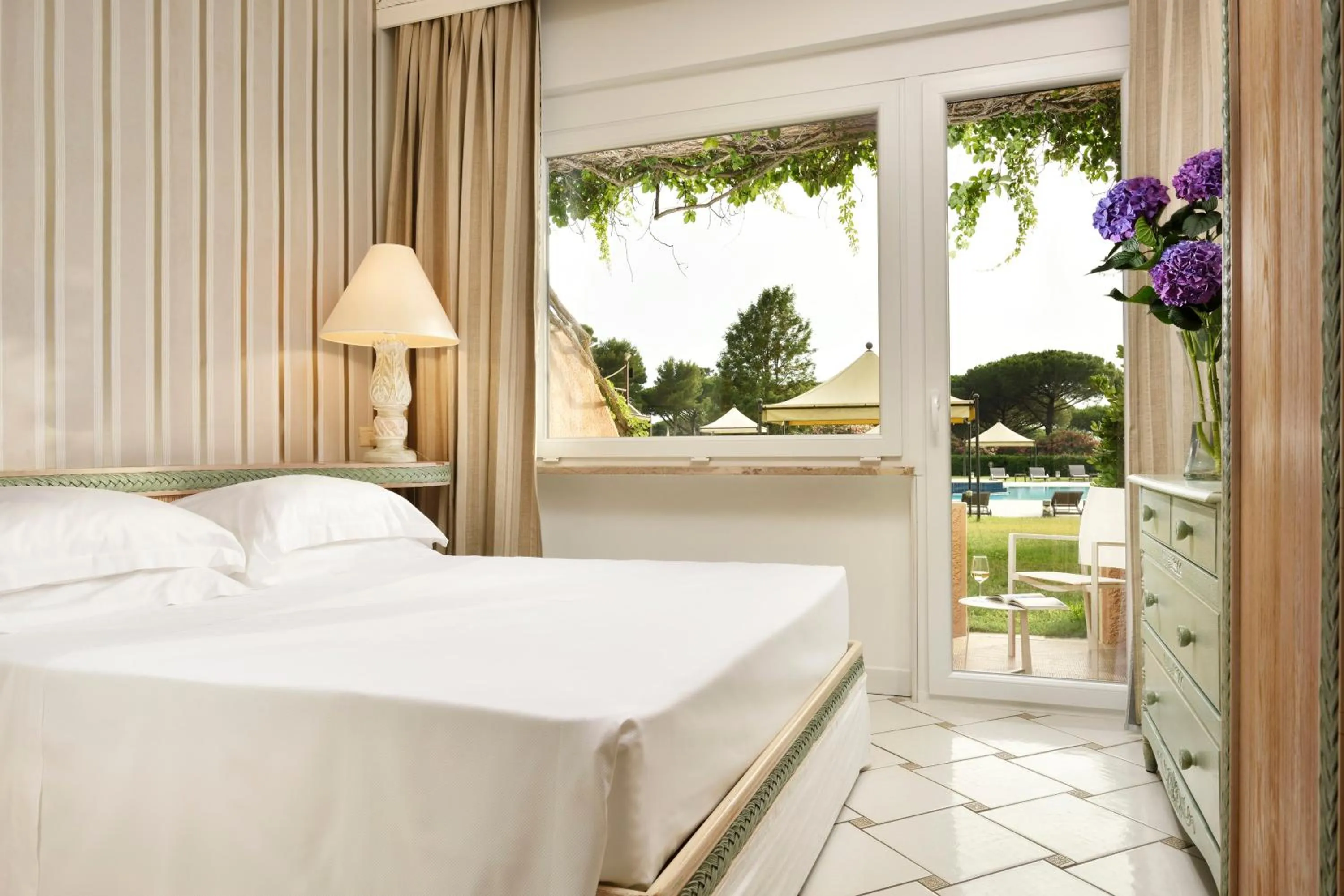 Patio, Bed in Golf Hotel Punta Ala