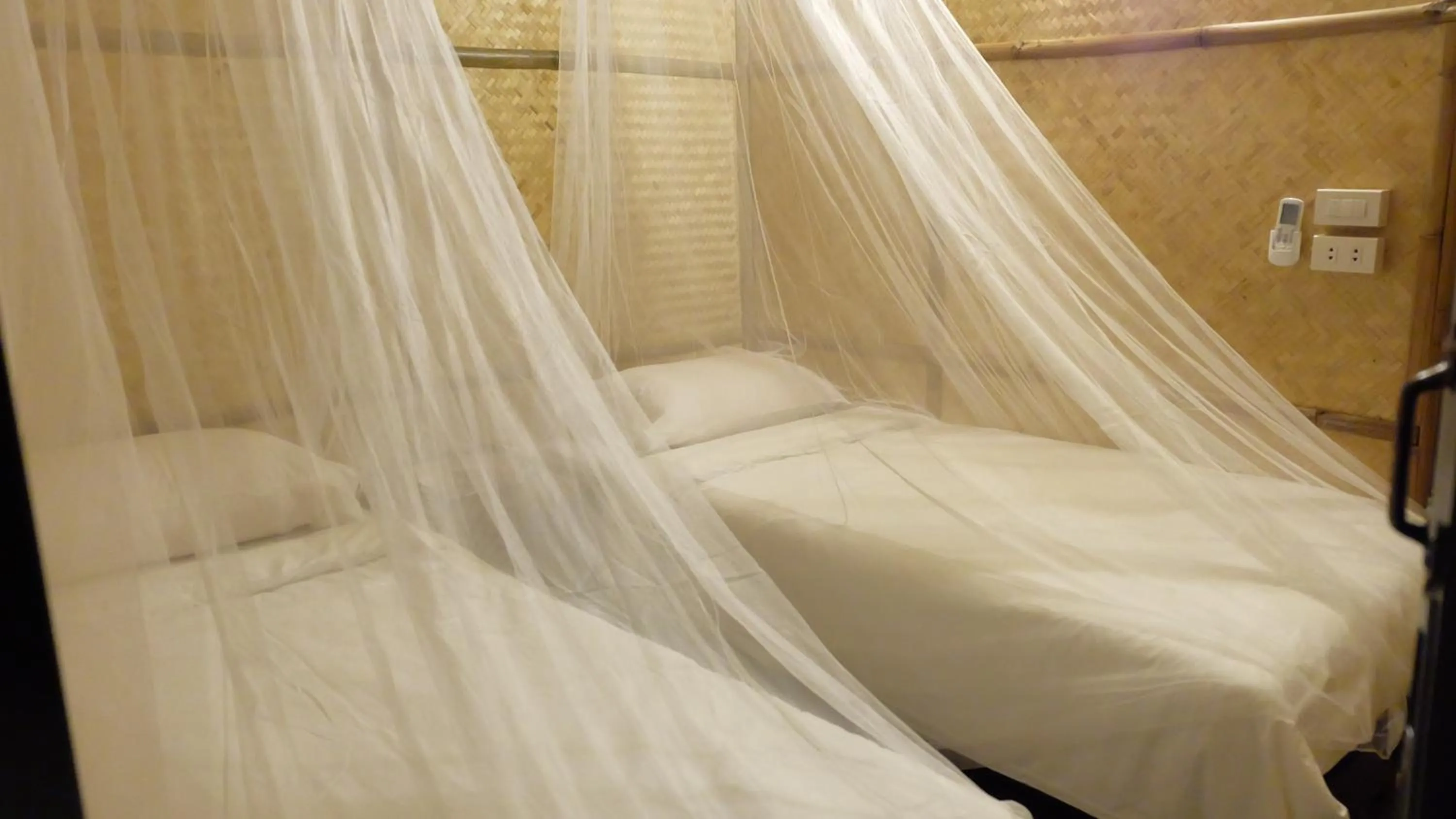 Bed in Lanna House Lanna Hut Chiangmai