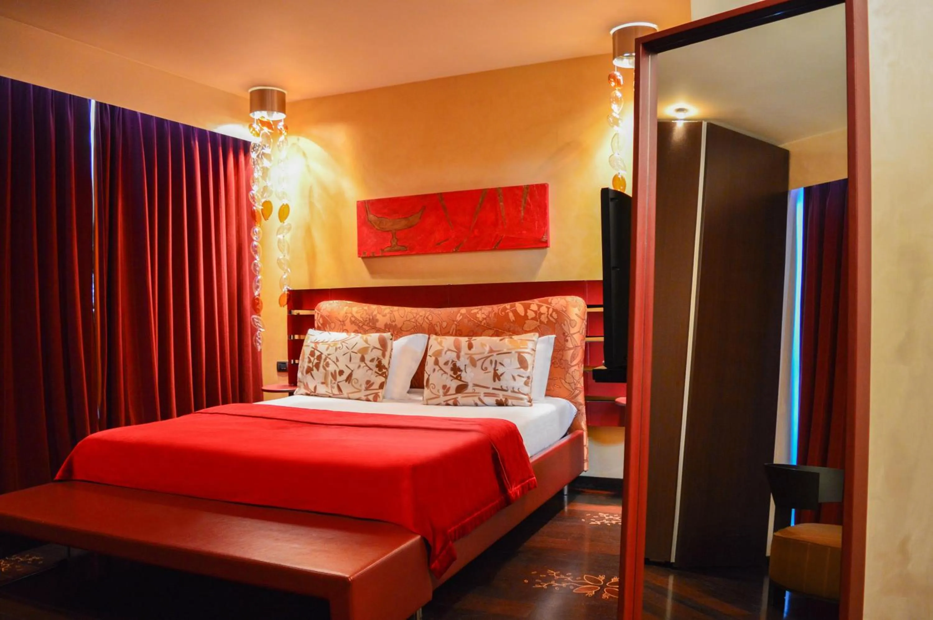 Bed in Les Fleurs Boutique Hotel