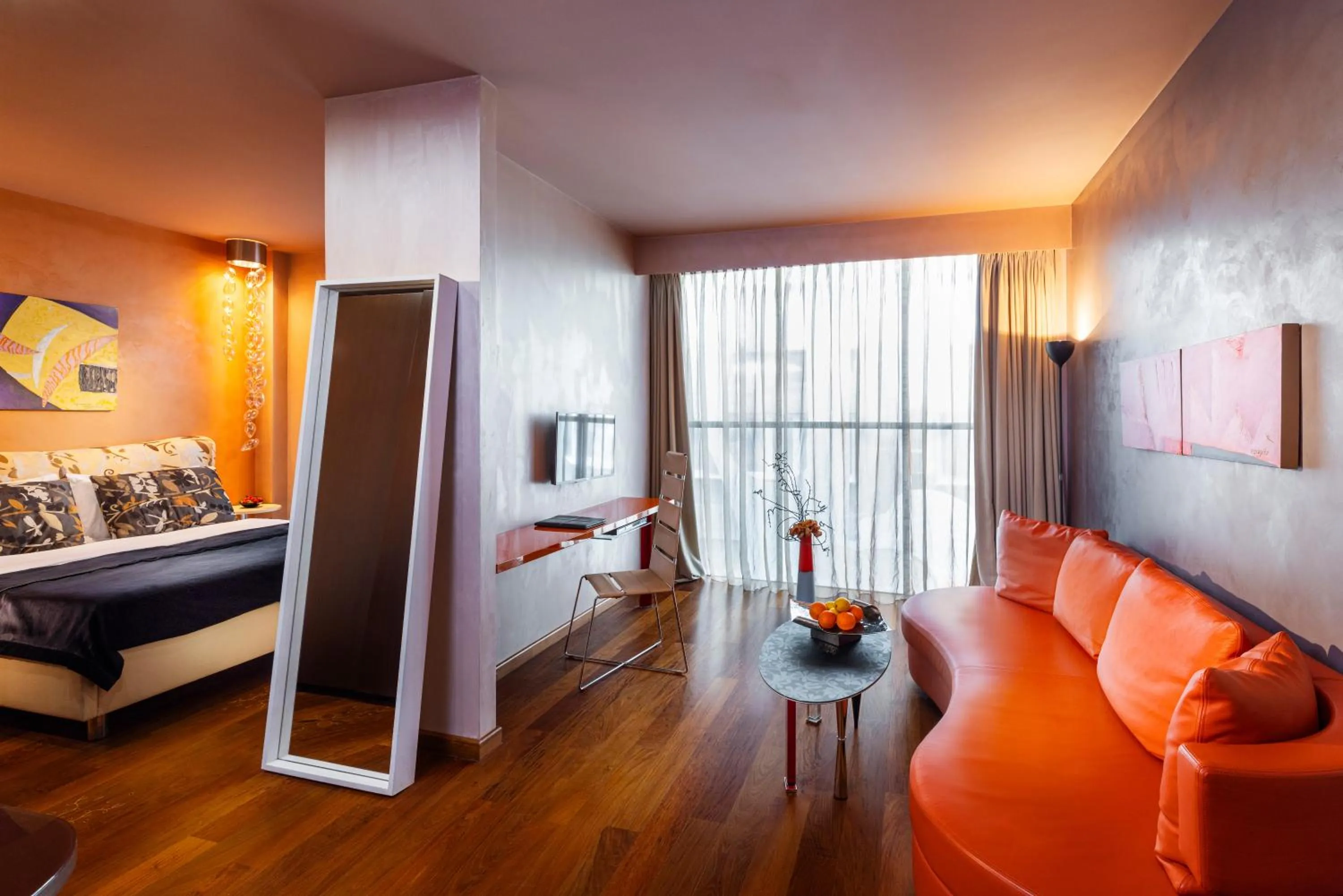 Communal lounge/ TV room, Bed in Les Fleurs Boutique Hotel