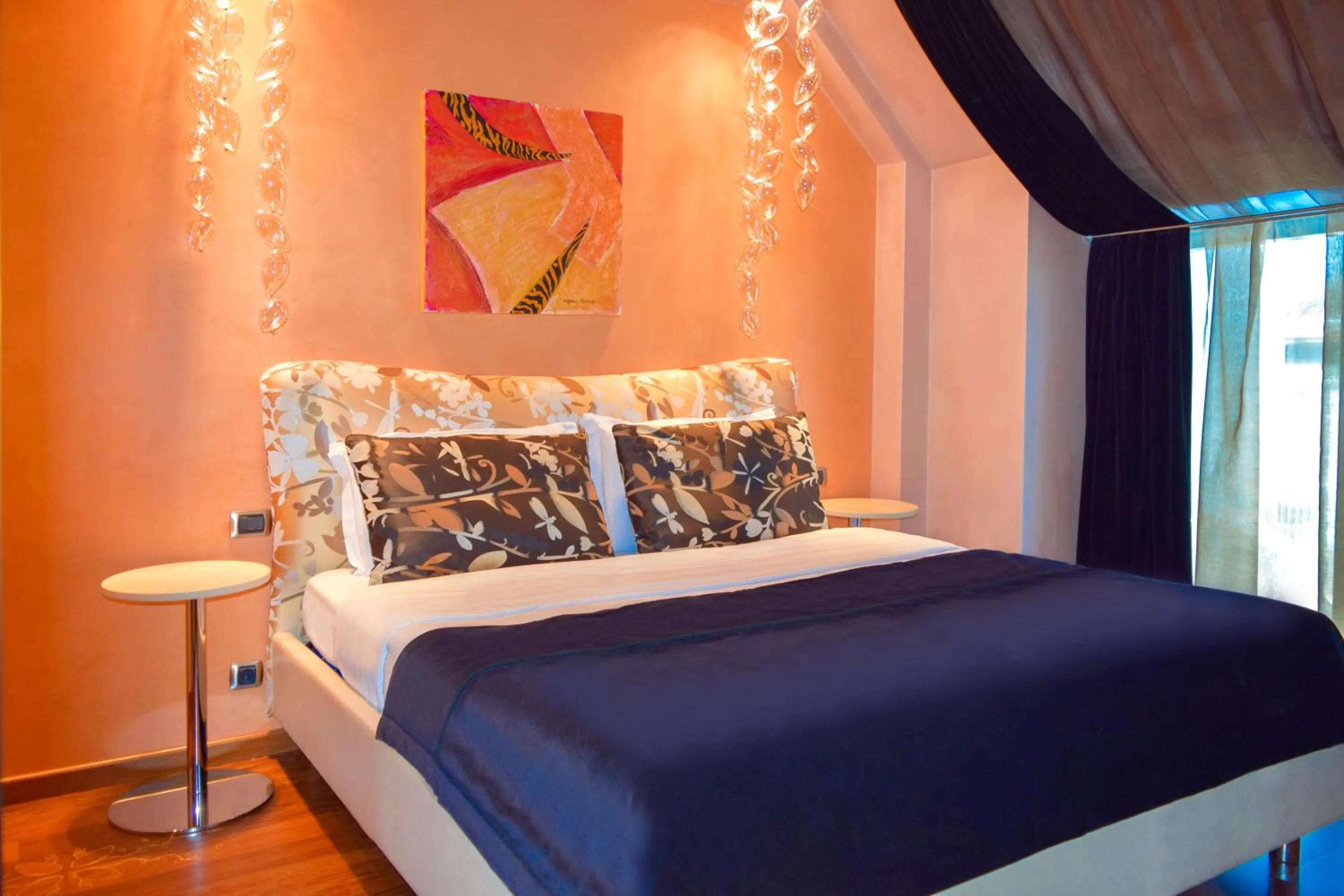 Bed in Les Fleurs Boutique Hotel