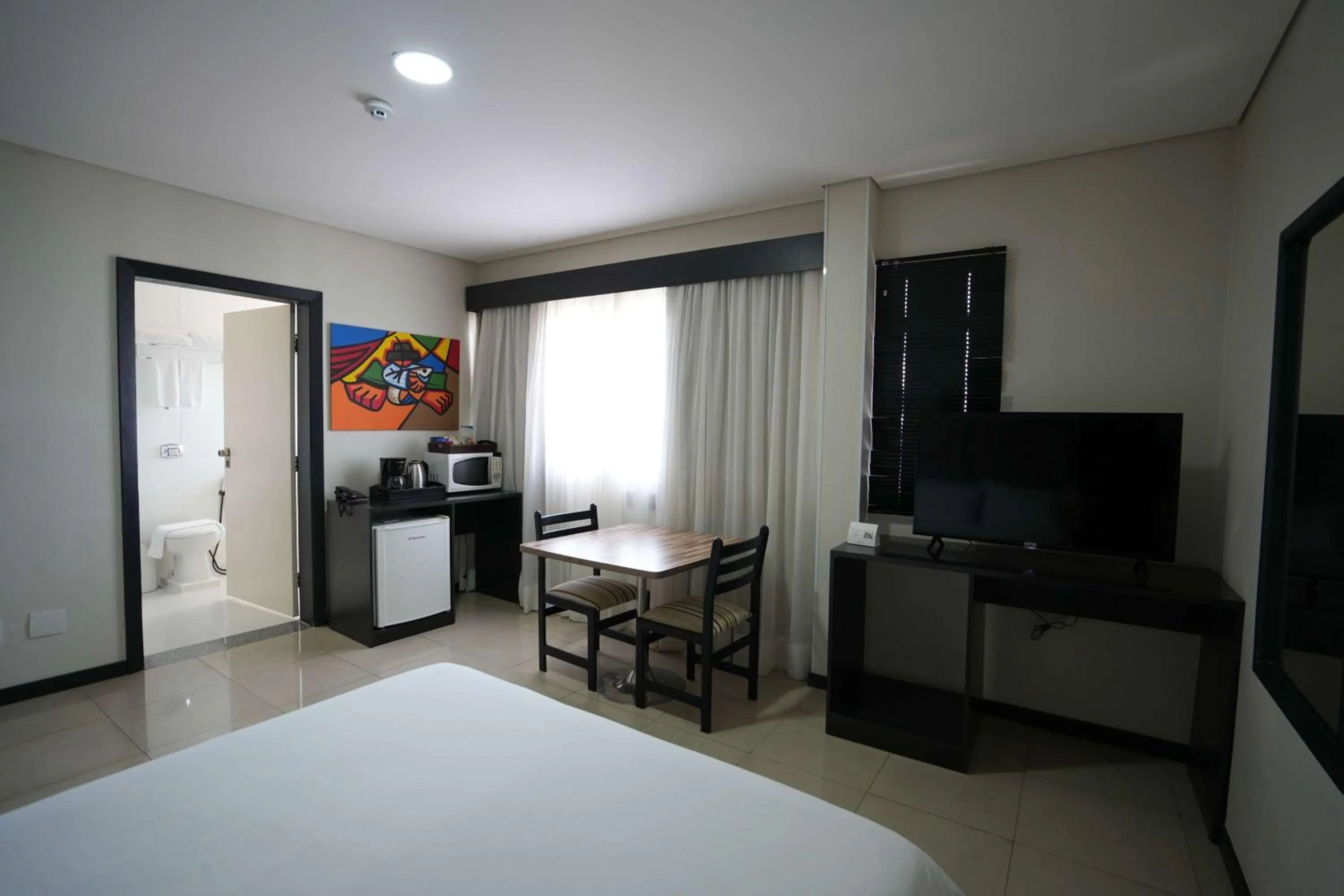 Photo of the whole room, Bed in Wyndham Golden Foz Suítes