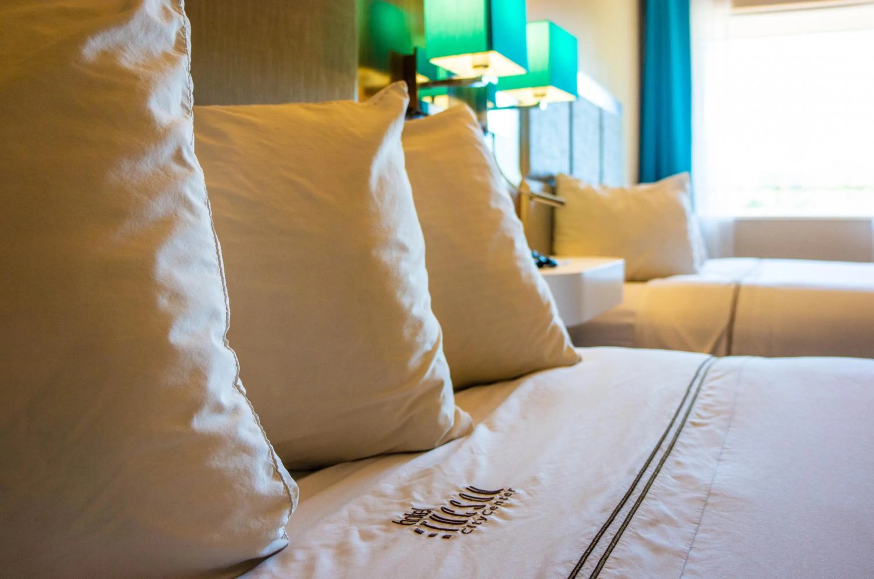 Bed, Seating Area in Hotel Tucson City Center, an Ascend Hotel Collection Member
