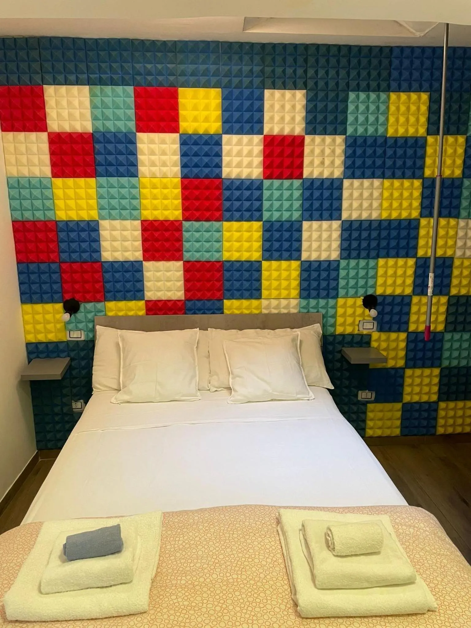 Bed in Terrazza Aragon Room and SPA