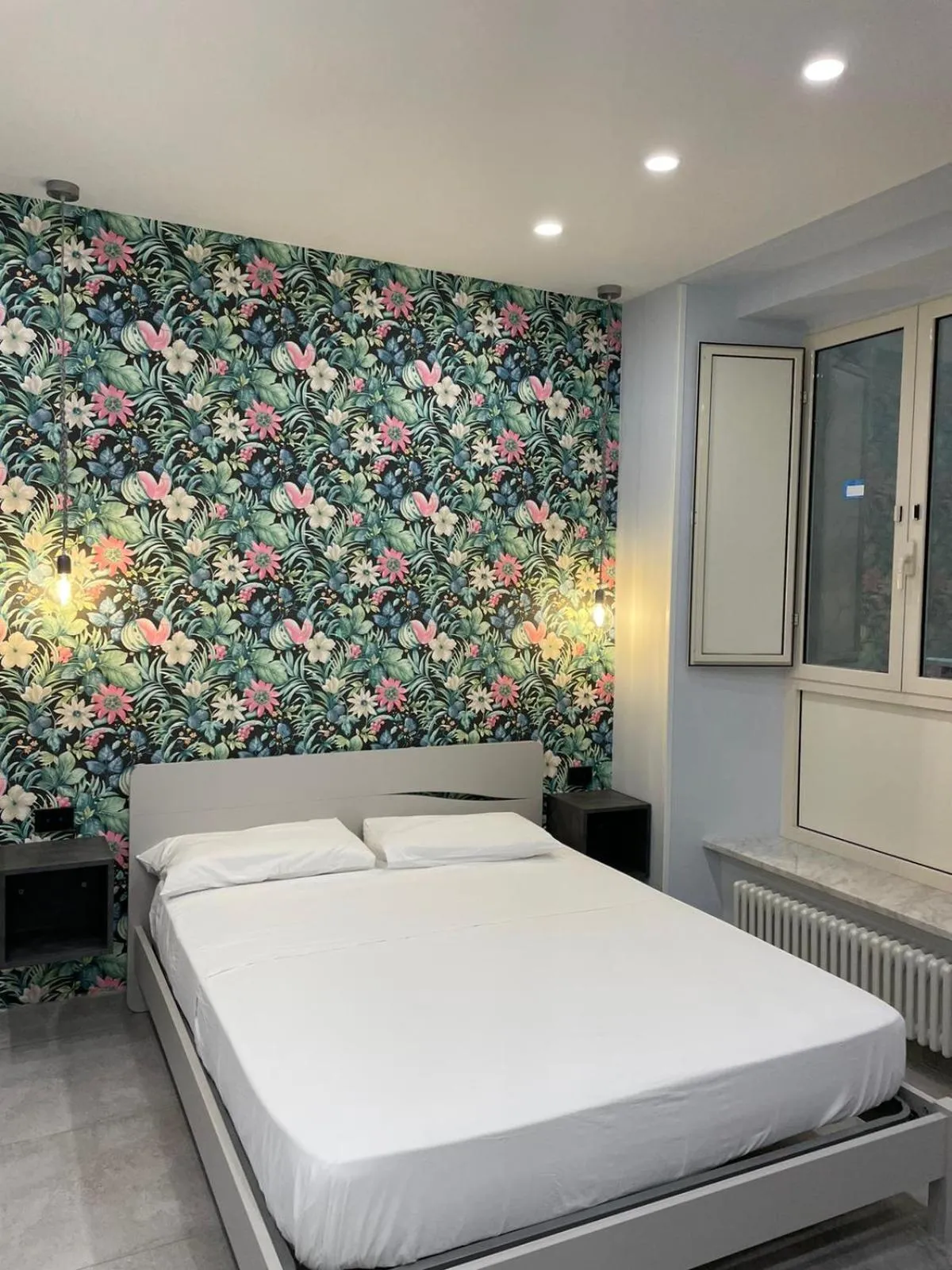 Bed in Terrazza Aragon Room and SPA