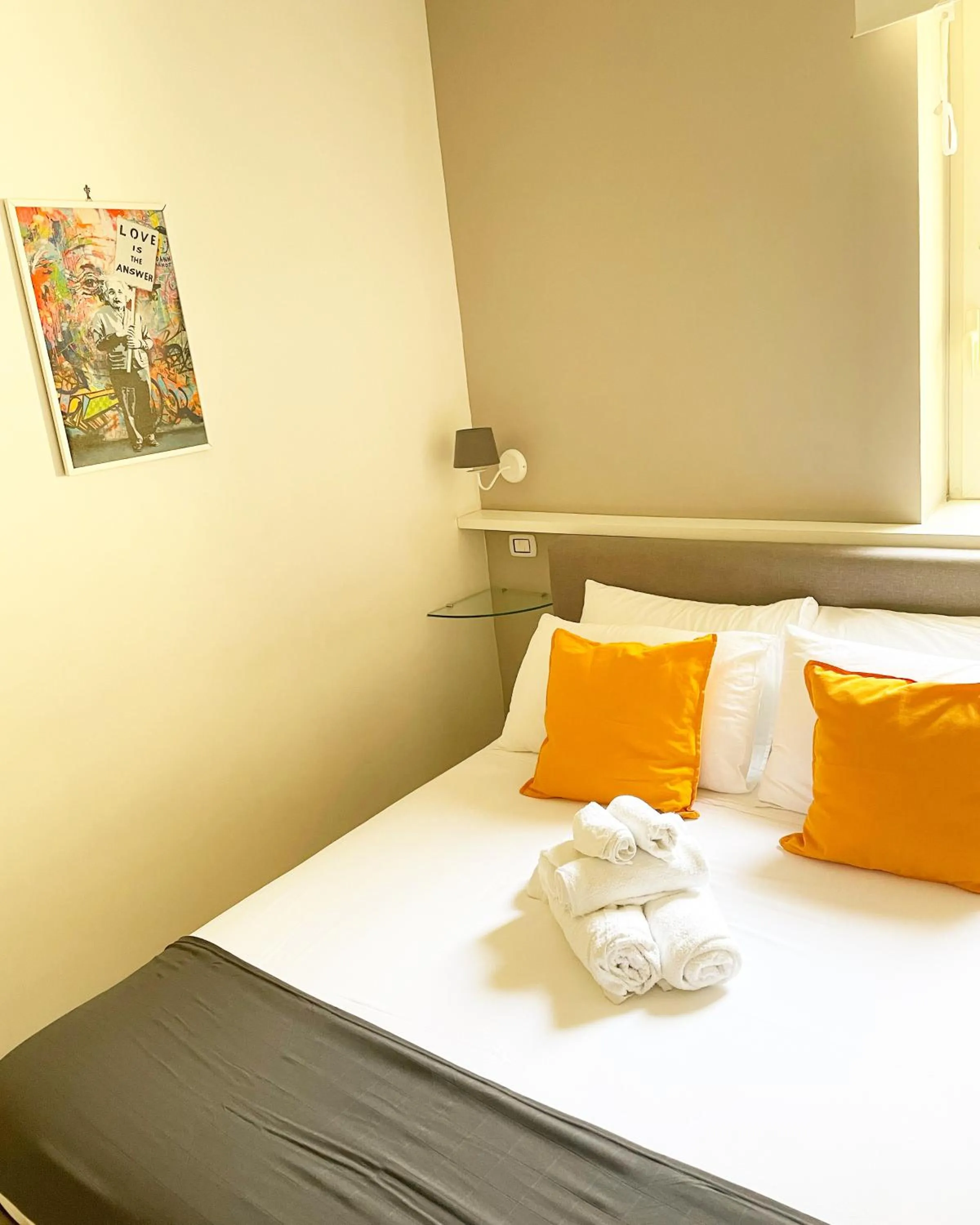 Bed in Terrazza Aragon Room and SPA