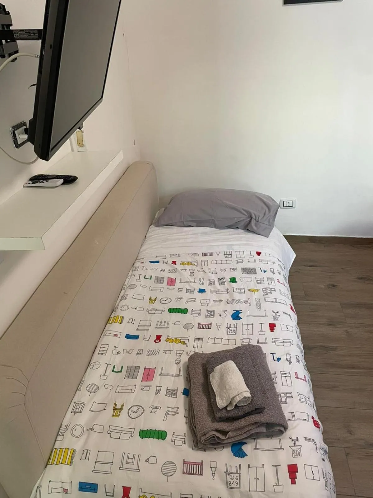 Bed in Terrazza Aragon Room and SPA