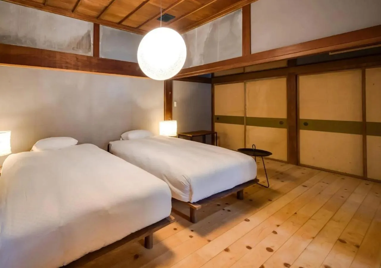 Bed in NIPPONIA Sawara Merchant Town Hotel