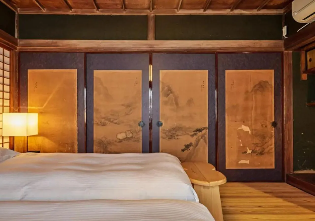 Bed in NIPPONIA Sawara Merchant Town Hotel