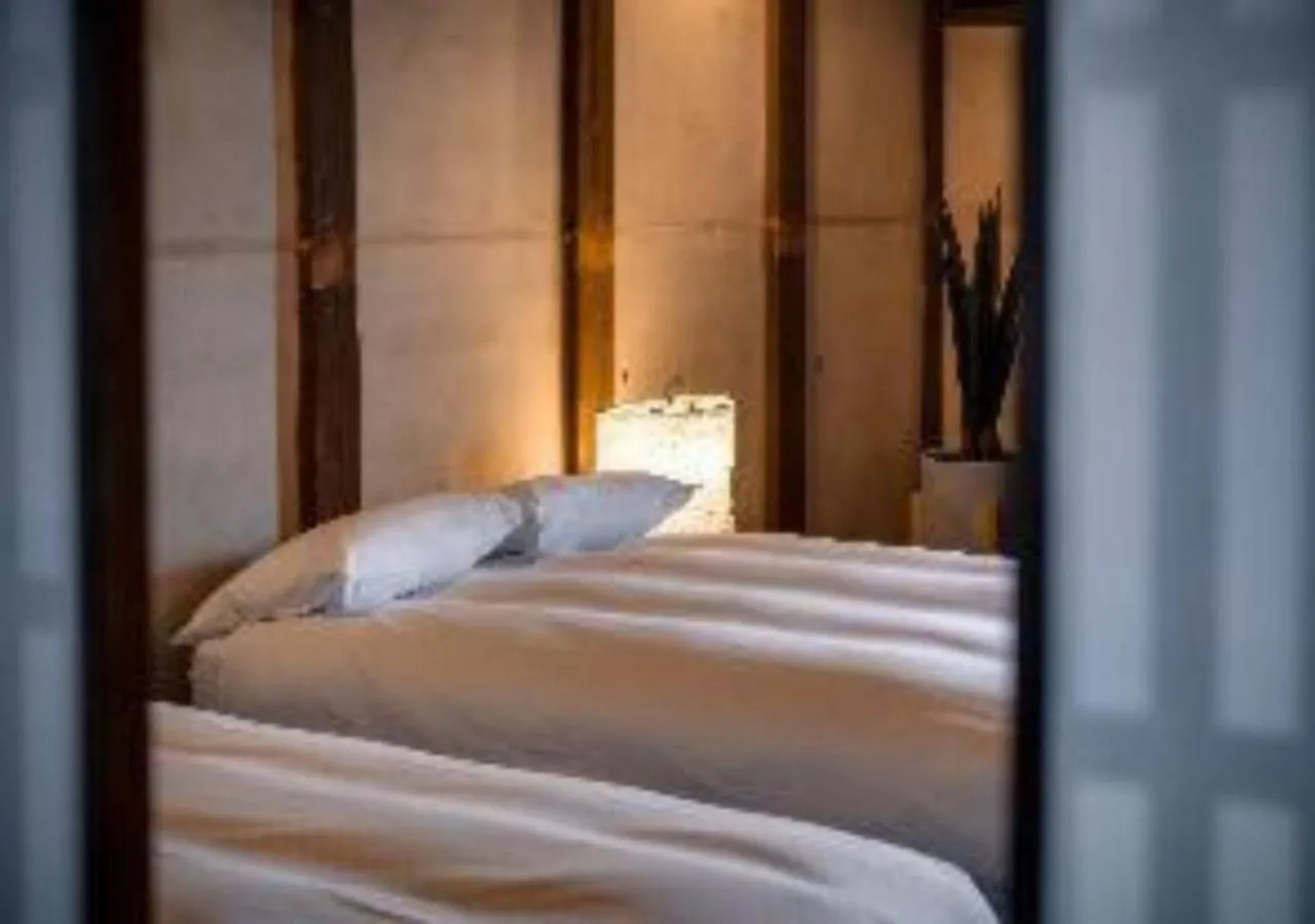 Bed in NIPPONIA Sawara Merchant Town Hotel