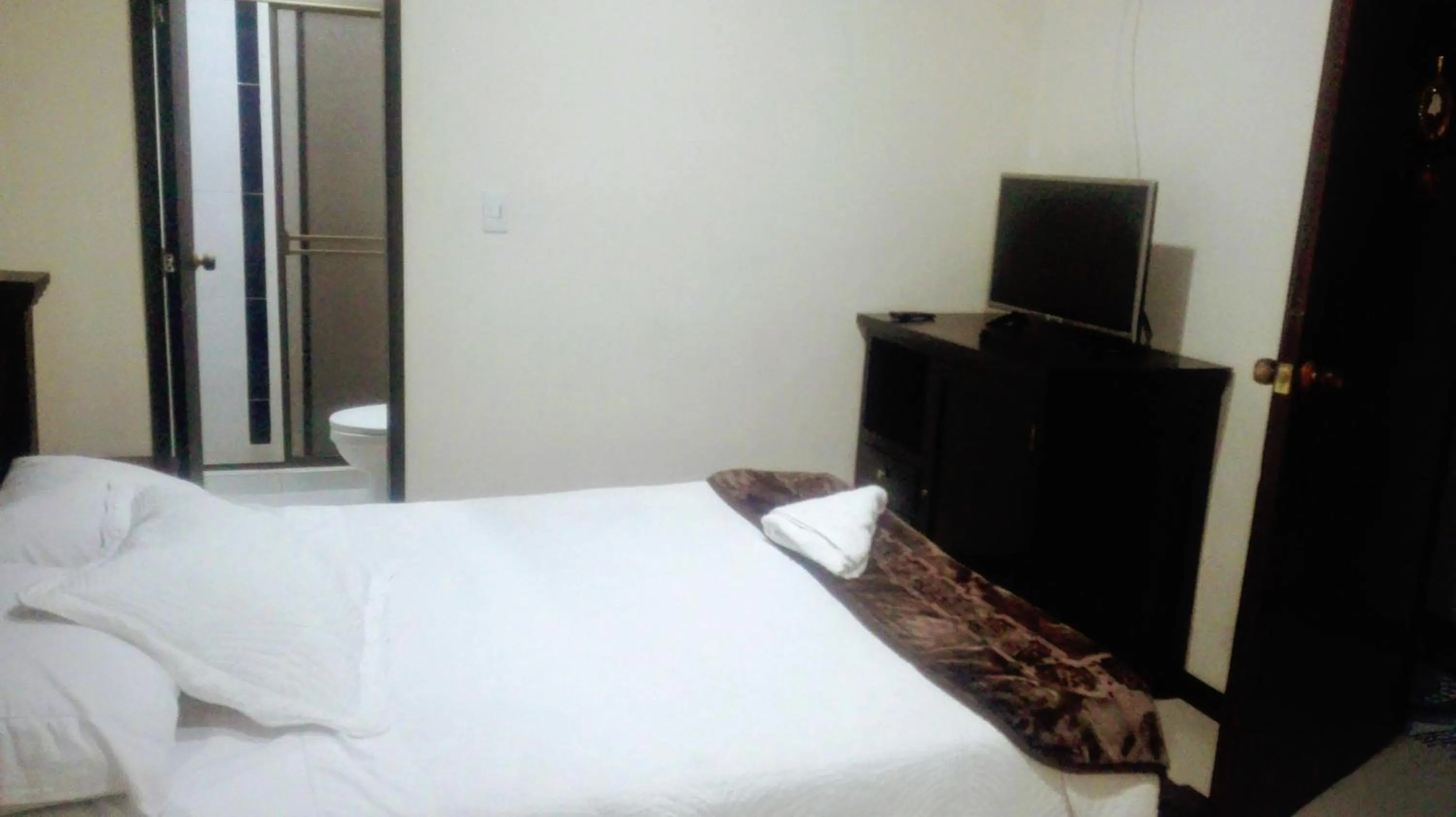 Bed in Hotel Aroma del Bosque Posada Cafe