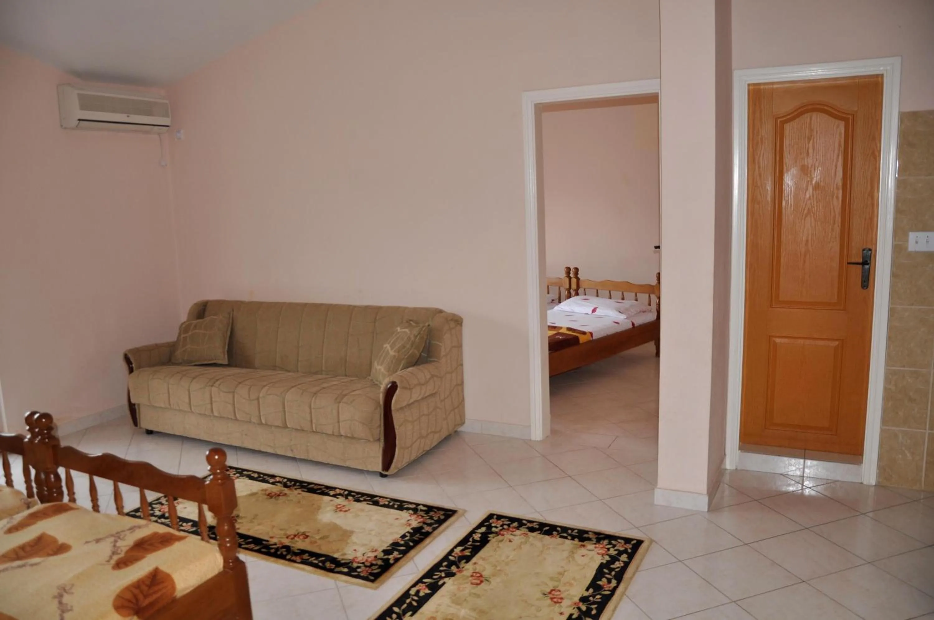 Seating area, Bed in Apartments Perezaj