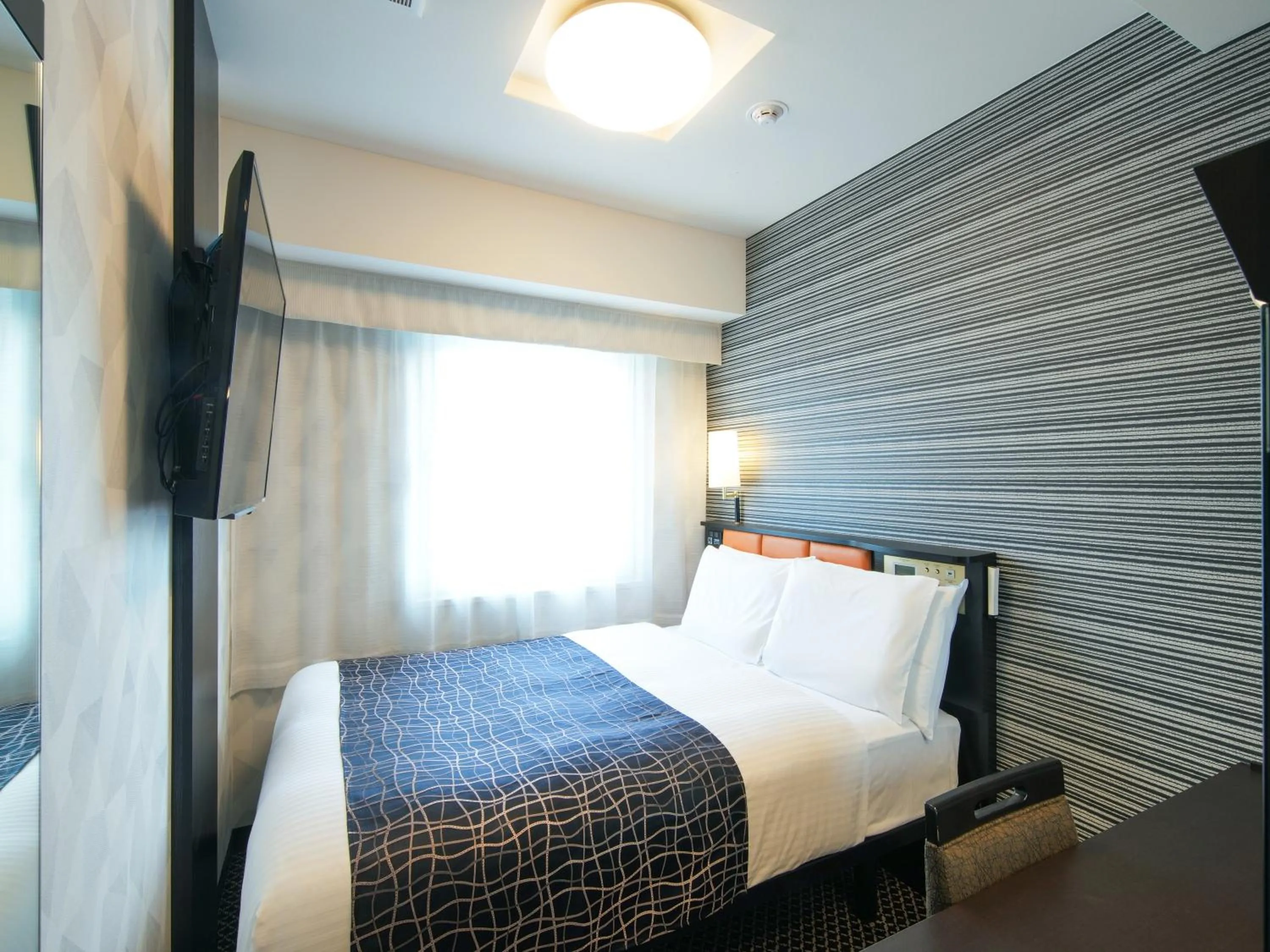 Bed in APA Hotel Higashi Umeda Minami Morimachi Ekimae