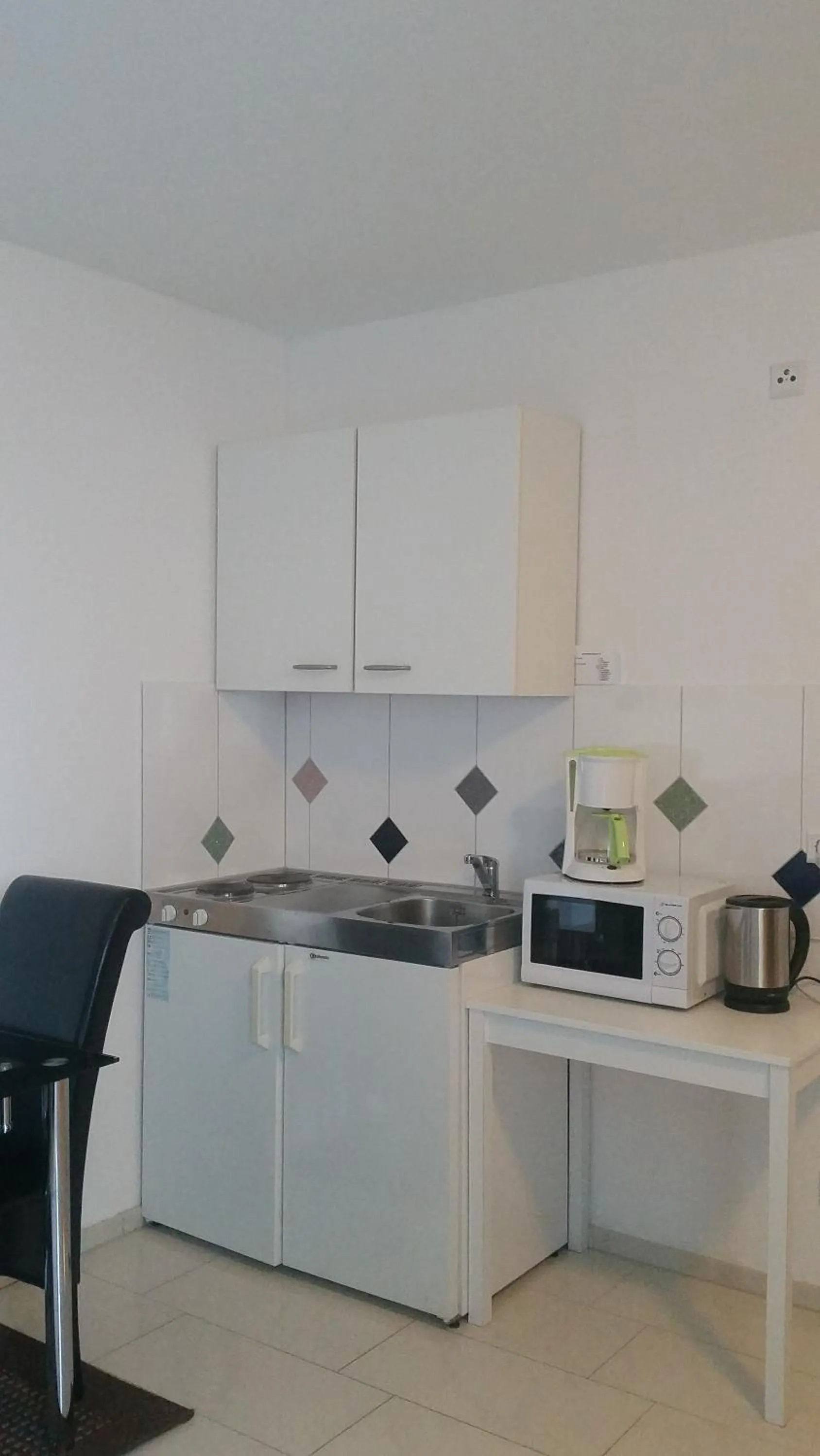 Kitchen or kitchenette in Cityhotel Ahlen Garni