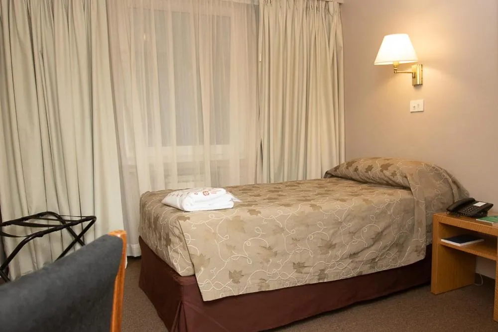 Bed in Comodoro Hotel