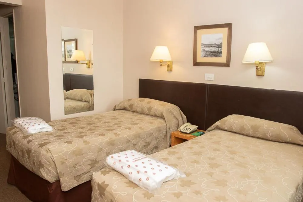 Bed in Comodoro Hotel