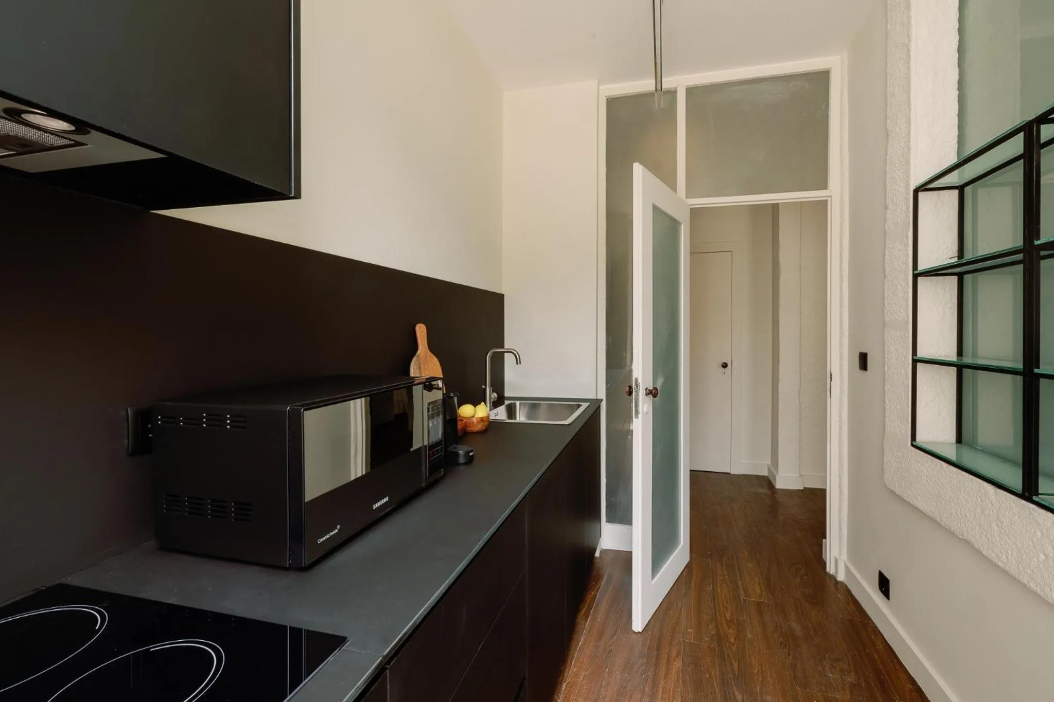 kitchen in Cosme Apartments by Olala Homes