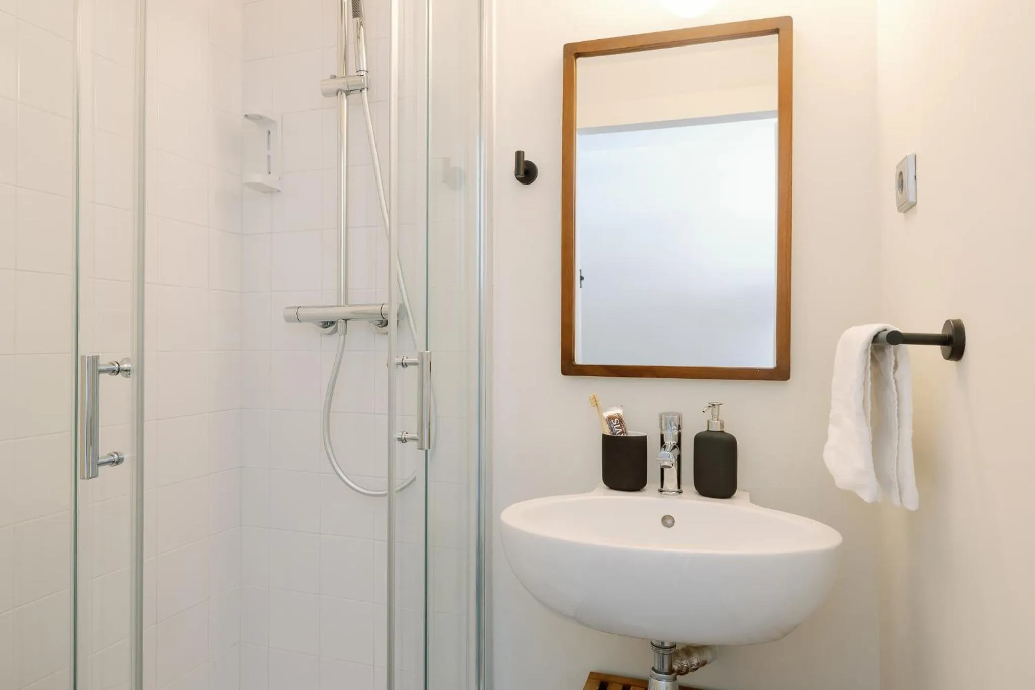 Bathroom in Cosme Apartments by Olala Homes