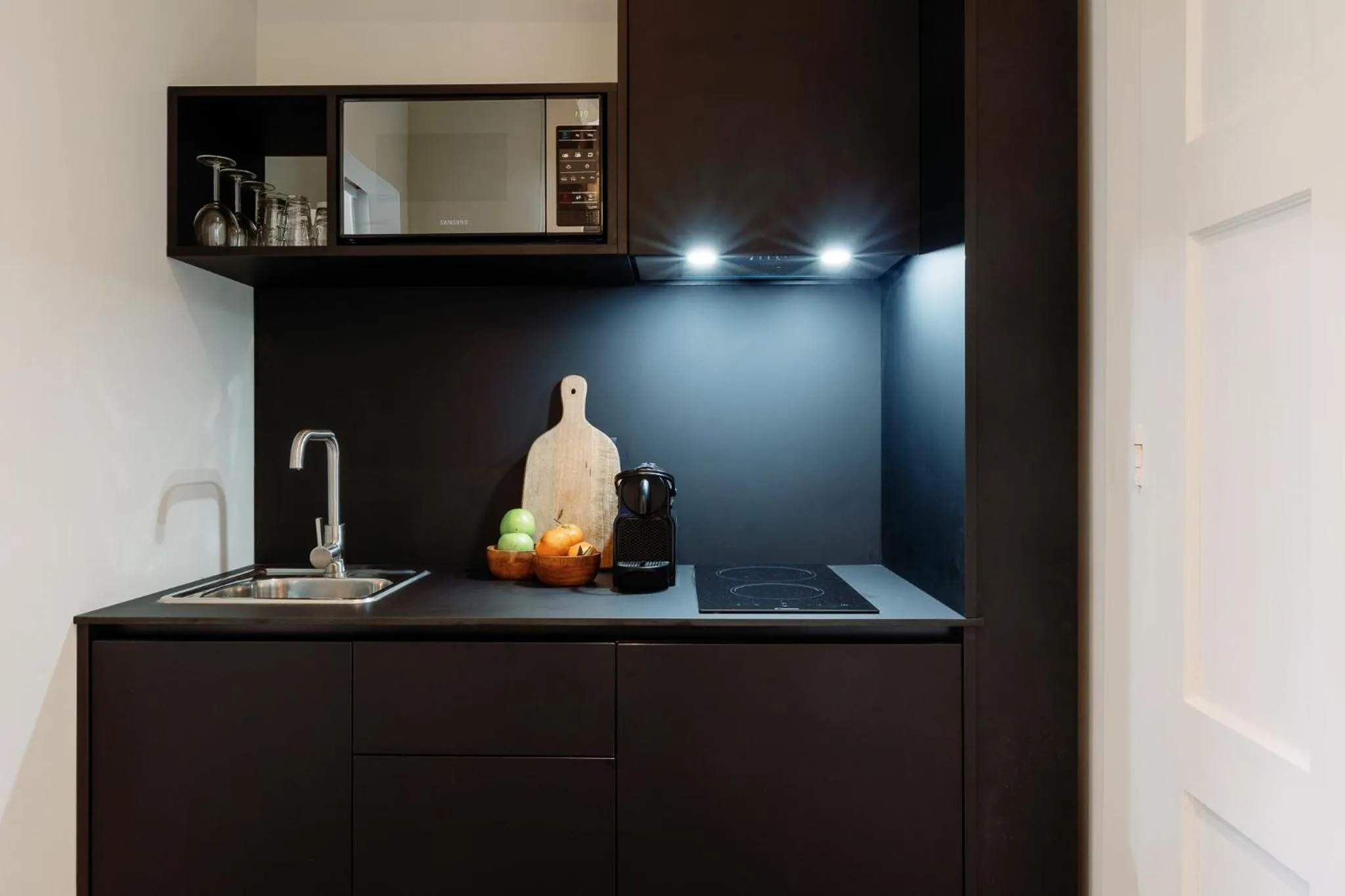 kitchen in Cosme Apartments by Olala Homes