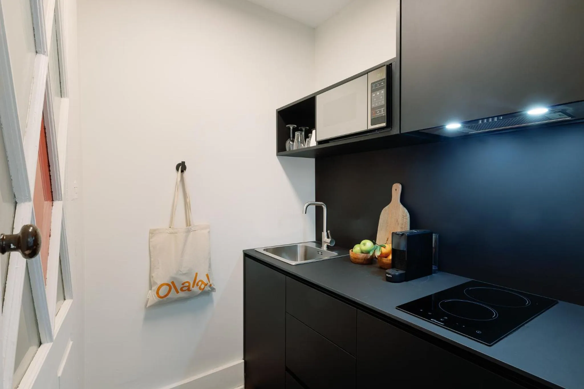 kitchen in Cosme Apartments by Olala Homes