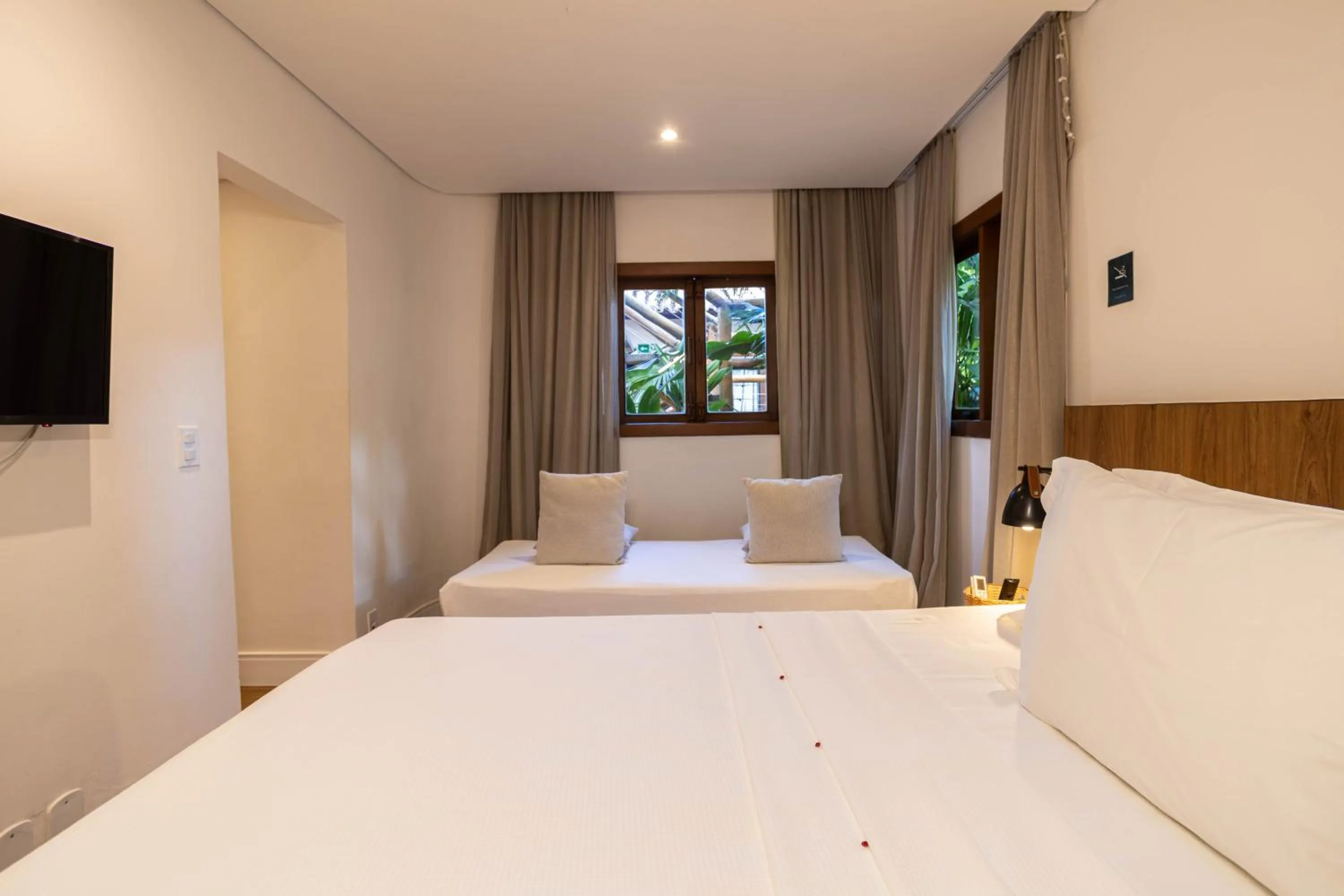 Property building, Bed in Pousada Cheiro Verde