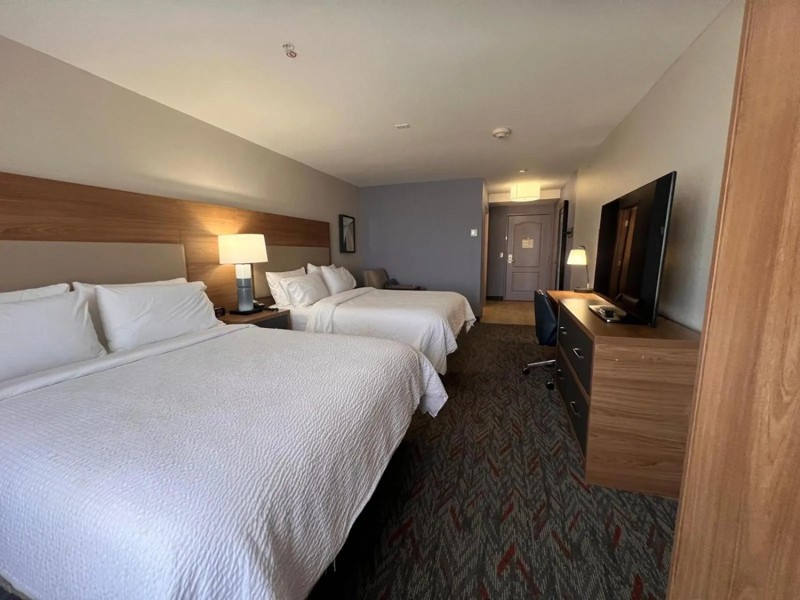 Communal lounge/ TV room, Bed in Days Inn & Suites by Wyndham Surprise