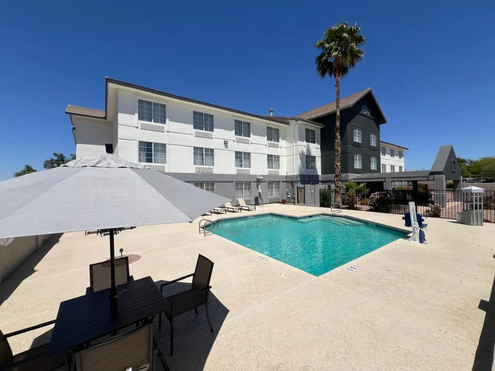 Swimming pool in Days Inn & Suites by Wyndham Surprise