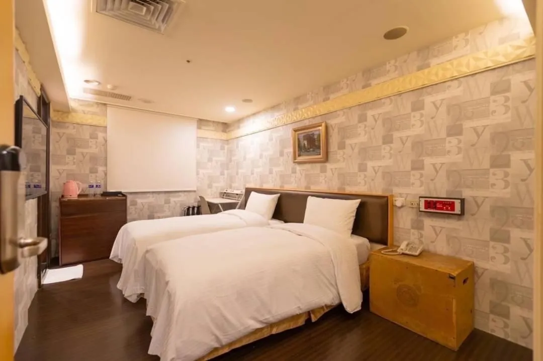 Photo of the whole room, Bed in Tai Lee Hotel