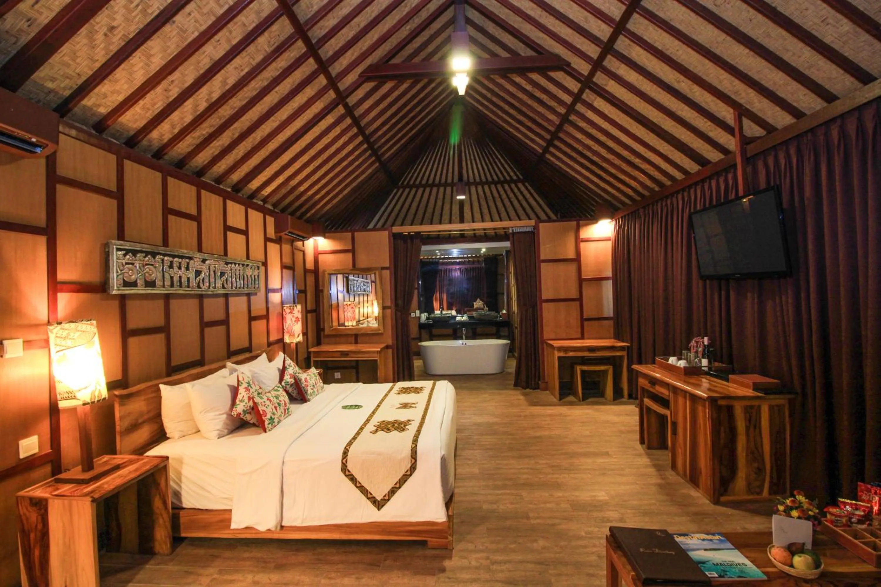 Photo of the whole room, Bed in Kupu Kupu Jimbaran Beach Hotel & Spa by L’Occitane