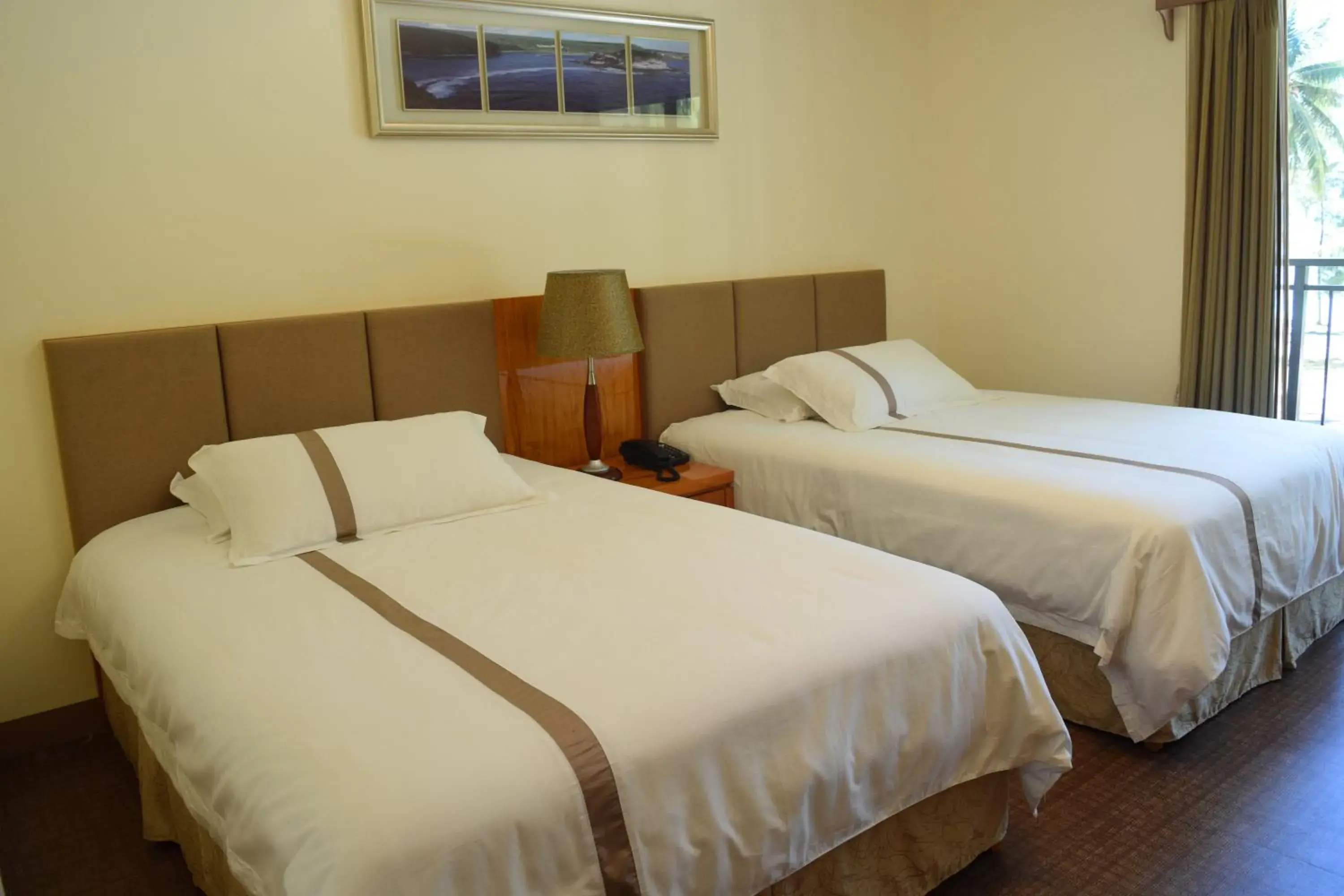 Deluxe Double Room (2 Adults + 1 Child) in Saipan Beach Hotel Deluxe Double Room (2 Adults + 1 Child) in Saipan Beach Hotel