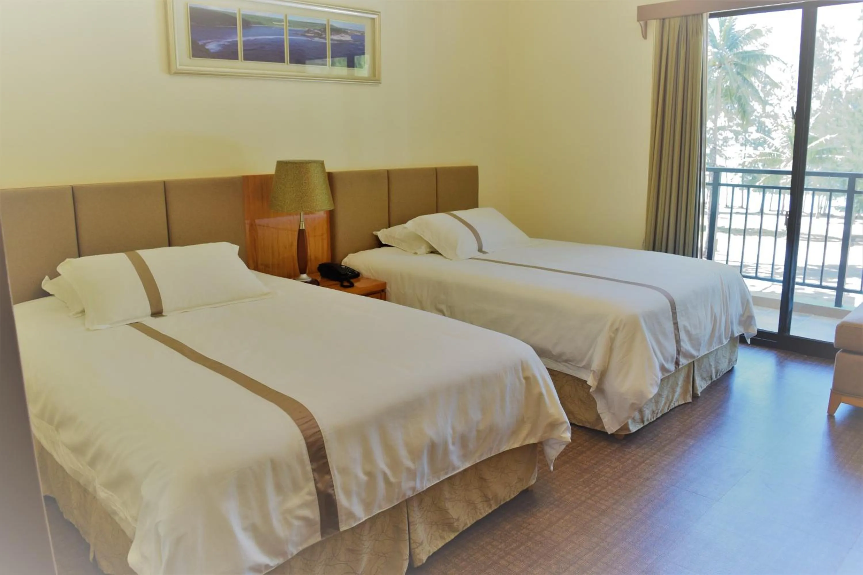 Bed in Saipan Beach Hotel