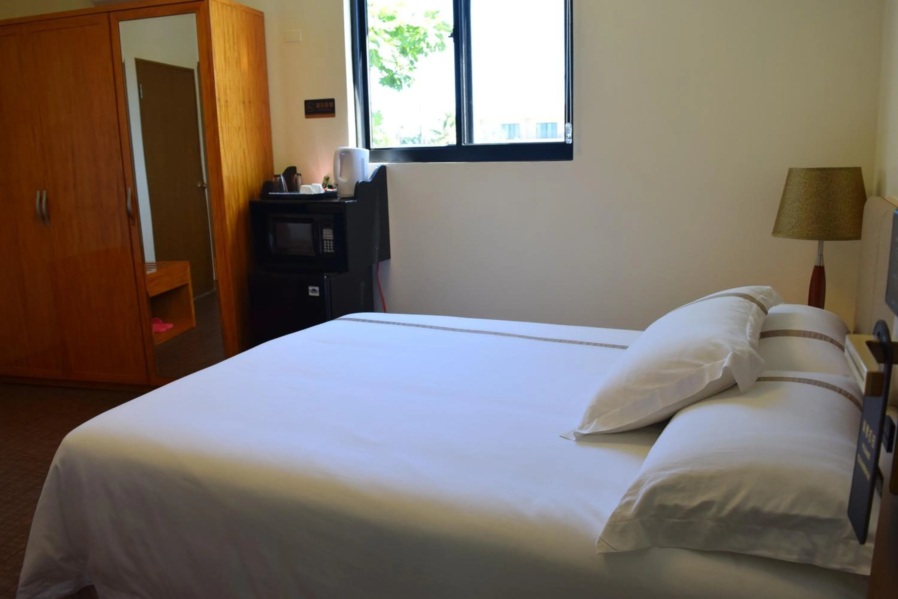 Bed in Saipan Beach Hotel