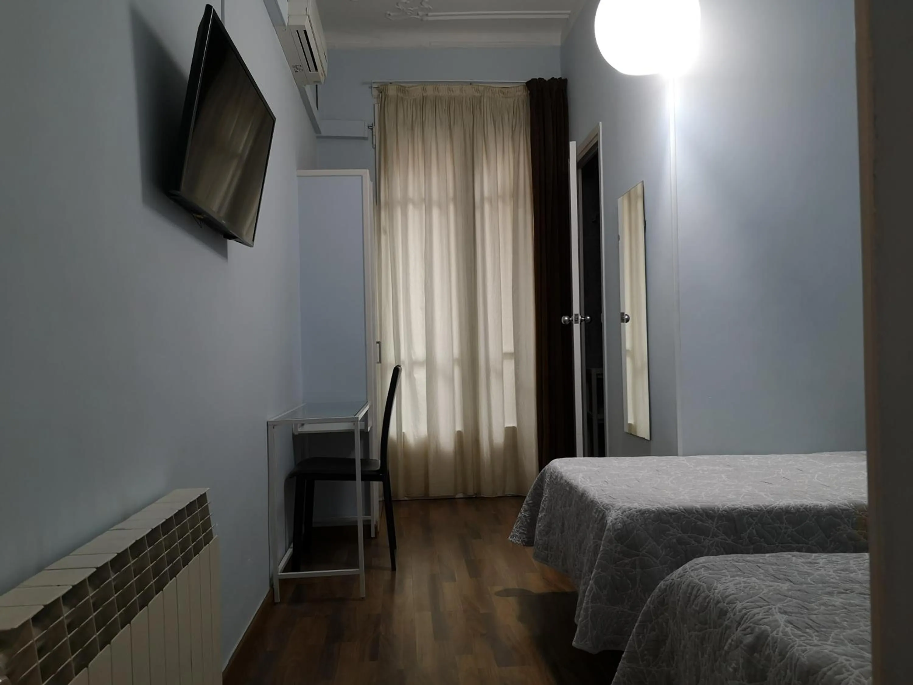 Bed in Hostal Lesseps