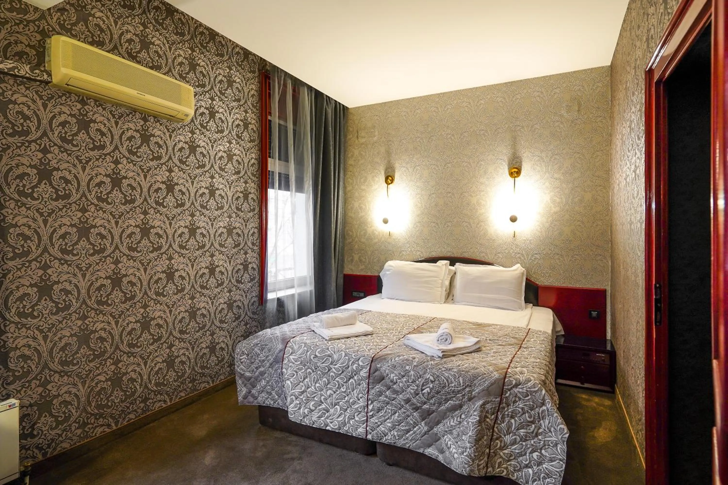 Bed in Gloria Palace Hotel