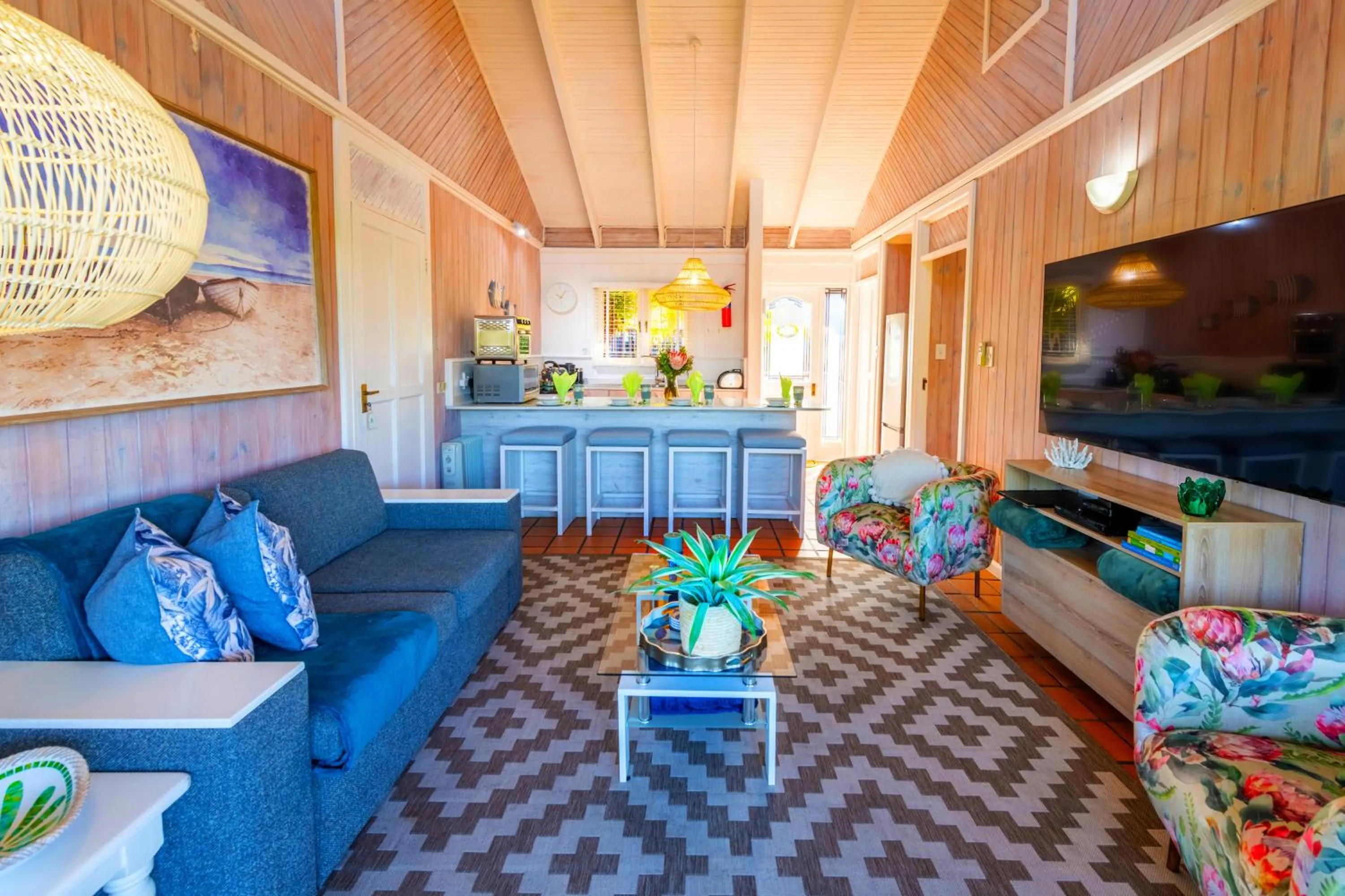 Communal lounge/ TV room in Knysna River Club by First Private Stays