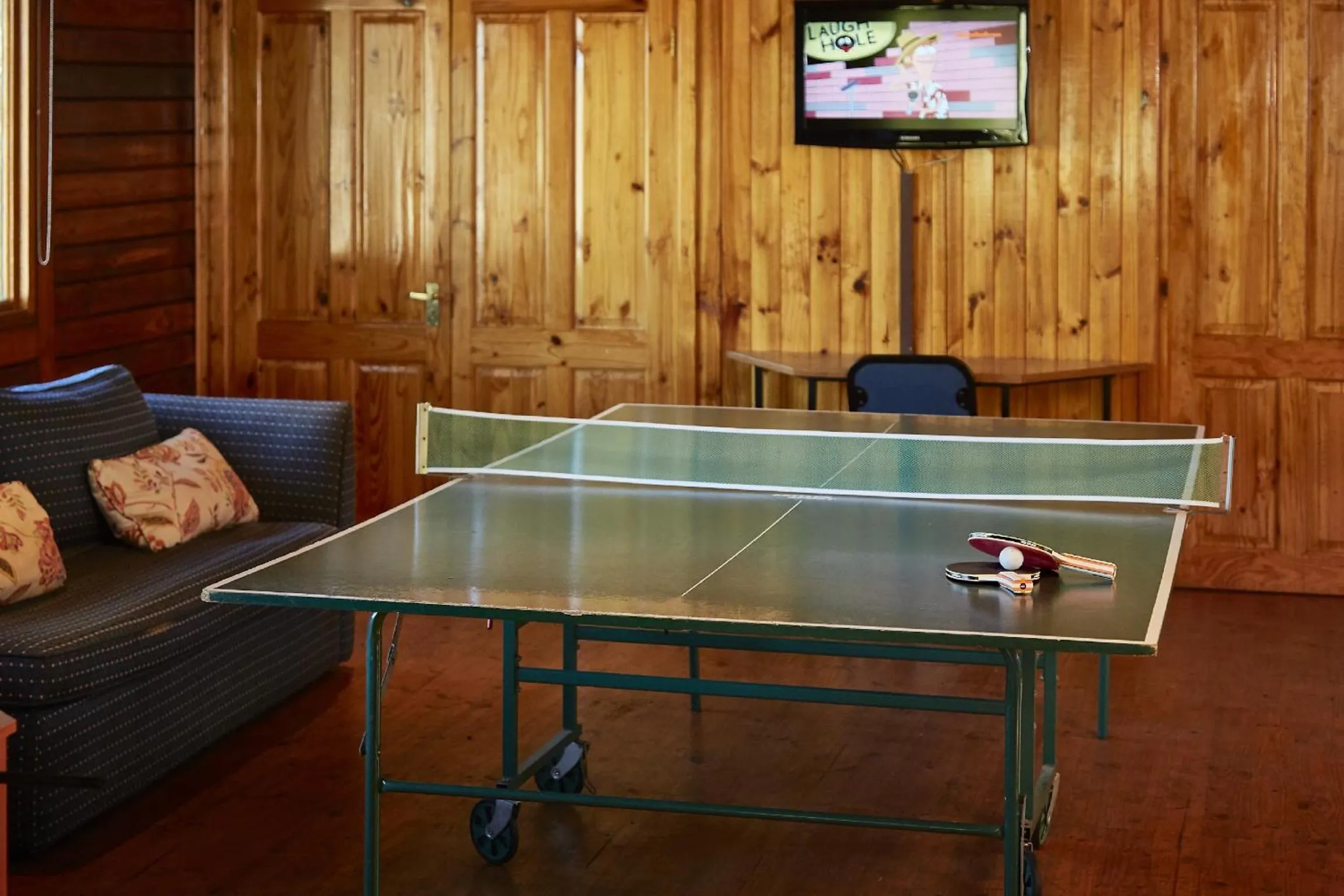 Communal lounge/ TV room in Knysna River Club by First Private Stays